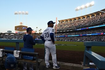 LOS ANGELES, CALIFORNIA - OCTOBER 09: Manager Dave Roberts of the Los Angeles Dodgers looks on from the dug out during the first inning of game five of the National League Division Series against the Washington Nationals at Dodger Stadium on October 09, 2
