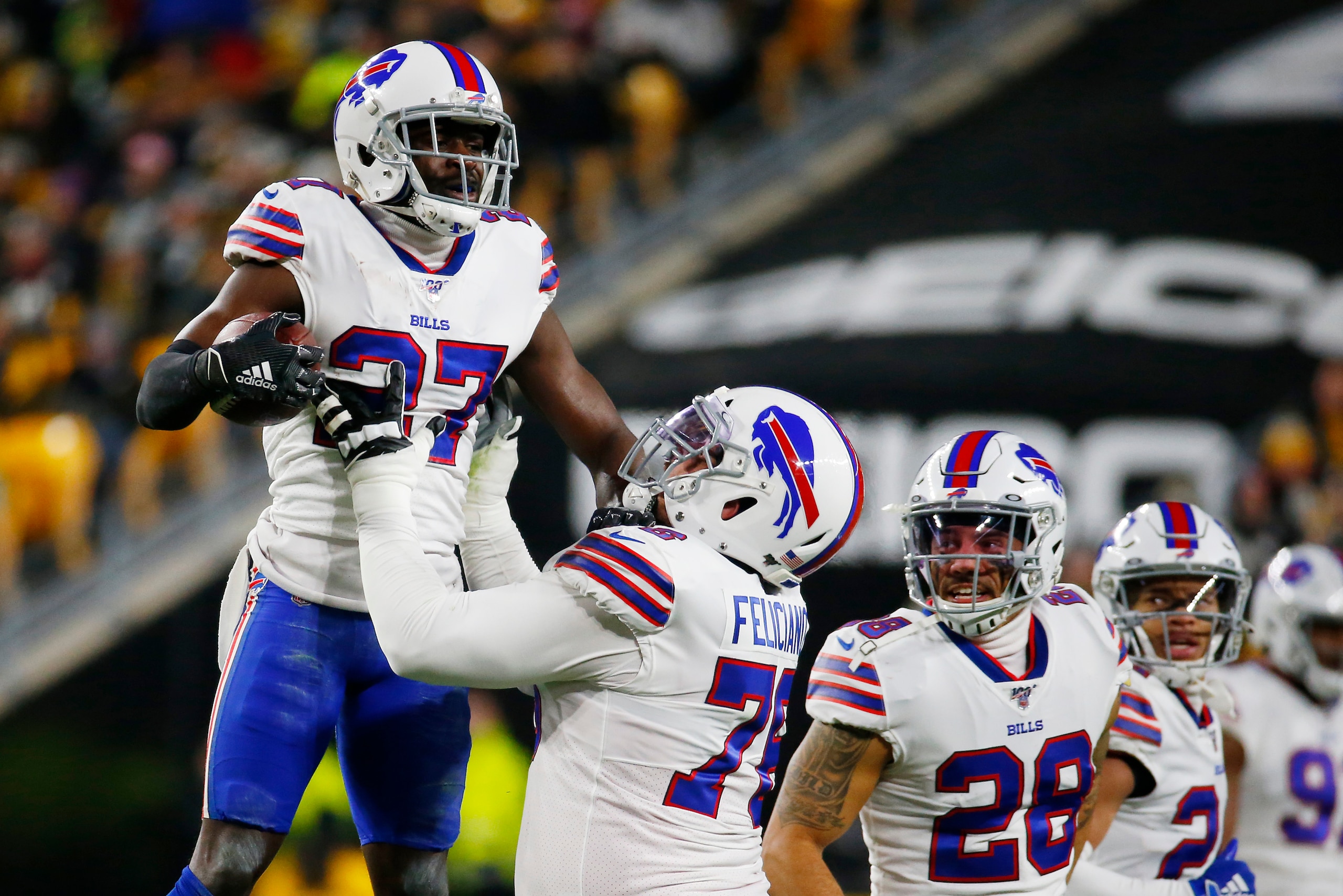 PITTSBURGH, PENNSYLVANIA - DECEMBER 15: Tre'Davious White #27 of the Buffalo Bills celebrates with teammates after intercepting a pass during the first quarter against the Pittsburgh Steelers in the game at Heinz Field on December 15, 2019 in Pittsburgh, 