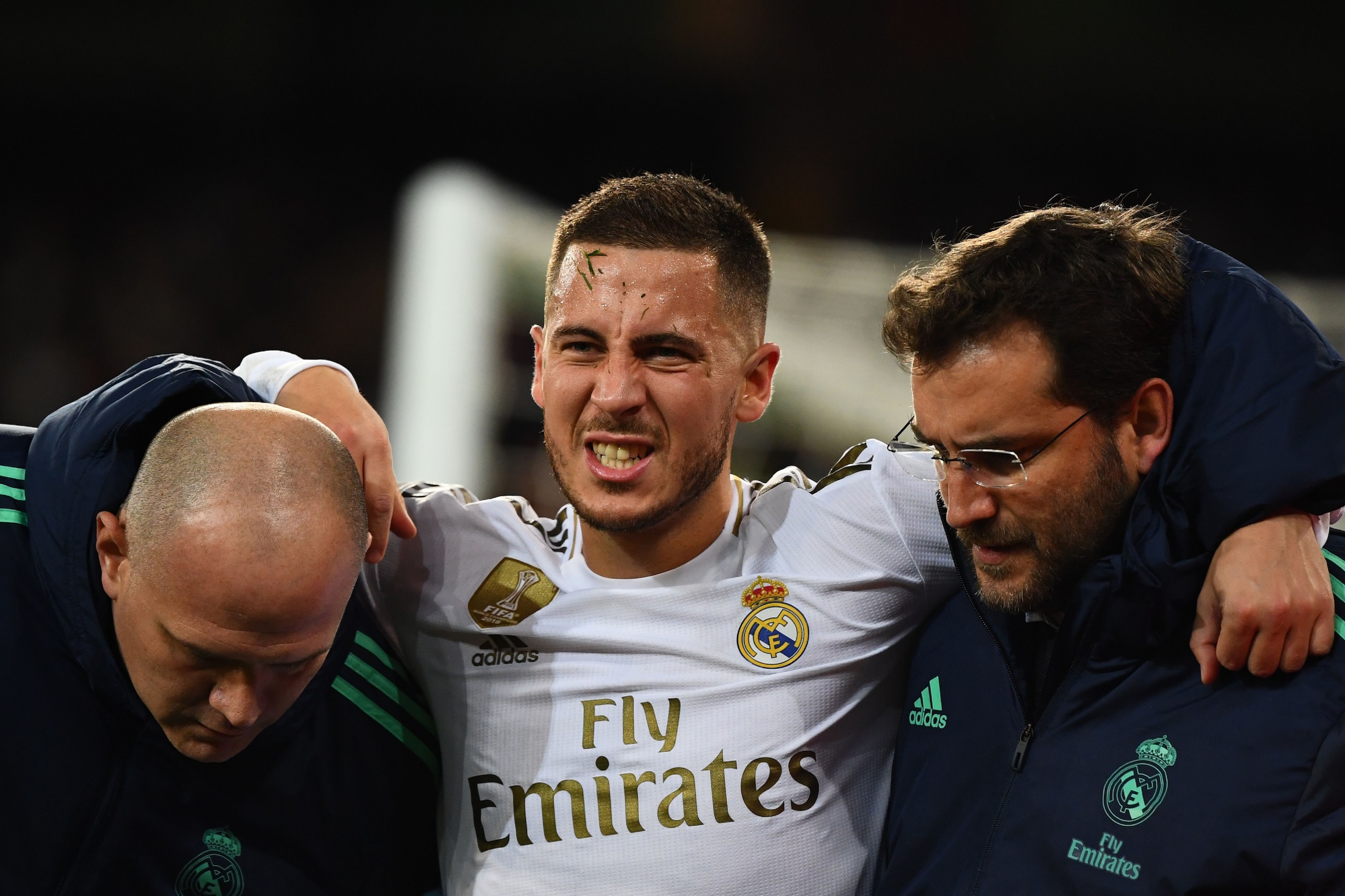 Real Madrid's Belgian forward Eden Hazard gestures in pain during the UEFA Champions League group A football match Real Madrid against Paris Saint-Germain FC at the Santiago Bernabeu stadium in Madrid on November 26, 2019. (Photo by GABRIEL BOUYS / AFP) (