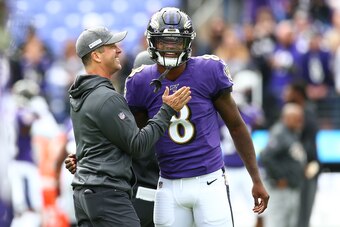 BALTIMORE, MD - OCTOBER 13: Head coach John Harbaugh interacts with Lamar Jackson #8 of the Baltimore Ravens prior to playing against the Cincinnati Bengals at M&T Bank Stadium on October 13, 2019 in Baltimore, Maryland. (Photo by Dan Kubus/Getty Images)