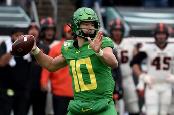 EUGENE, OREGON - NOVEMBER 30: Quarterback Justin Herbert #10 of the Oregon Ducks passes the ball during the first half of the game against the Oregon State Beavers at Autzen Stadium on November 30, 2019 in Eugene, Oregon. (Photo by Steve Dykes/Getty Image