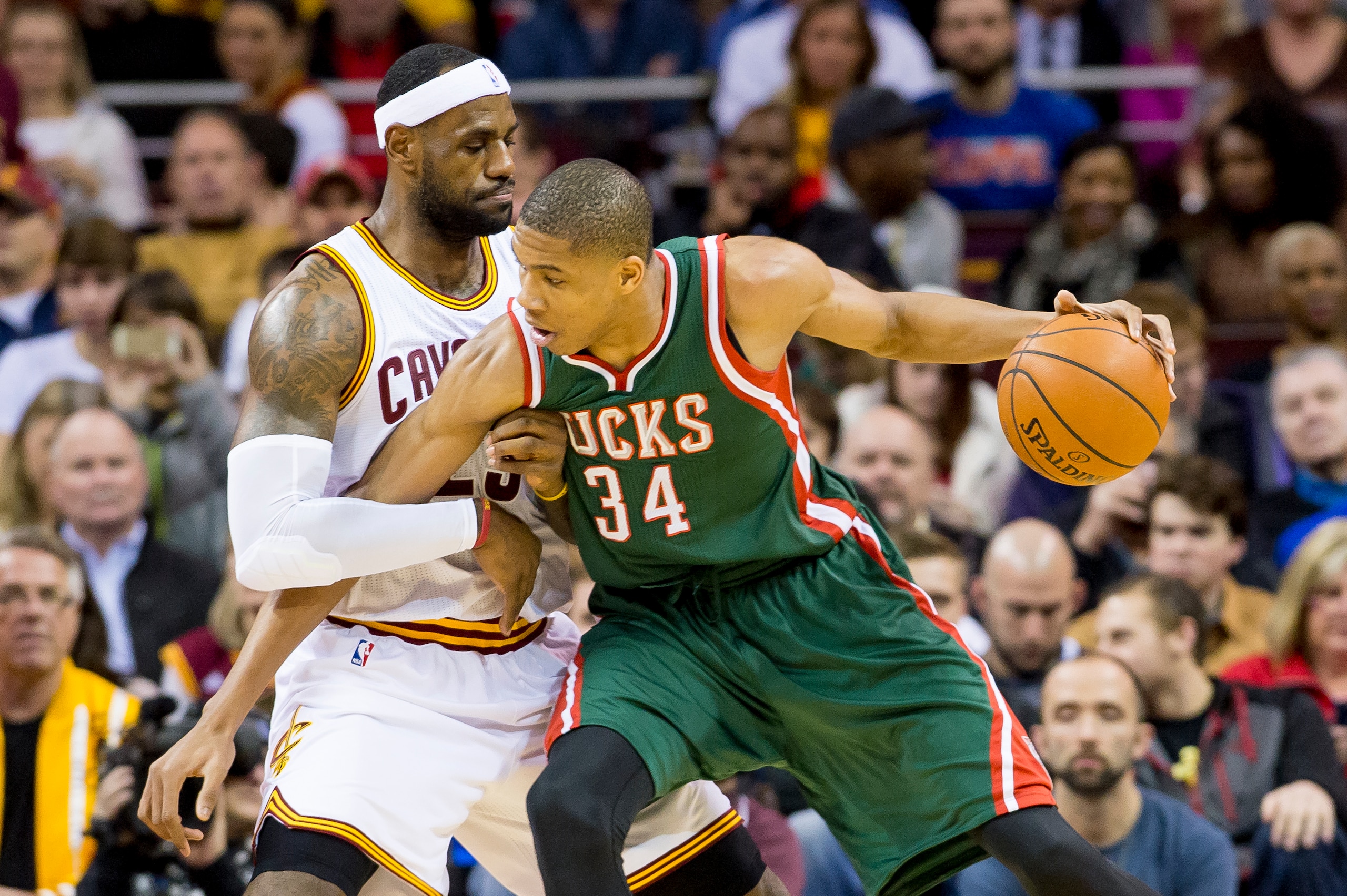 CLEVELAND, OH - DECEMBER 2: Giannis Antetokounmpo #34 of the Milwaukee Bucks posts up against LeBron James #23 of the Cleveland Cavaliers during the first half at Quicken Loans Arena on December 2, 2014 in Cleveland, Ohio. NOTE TO USER: User expressly ack