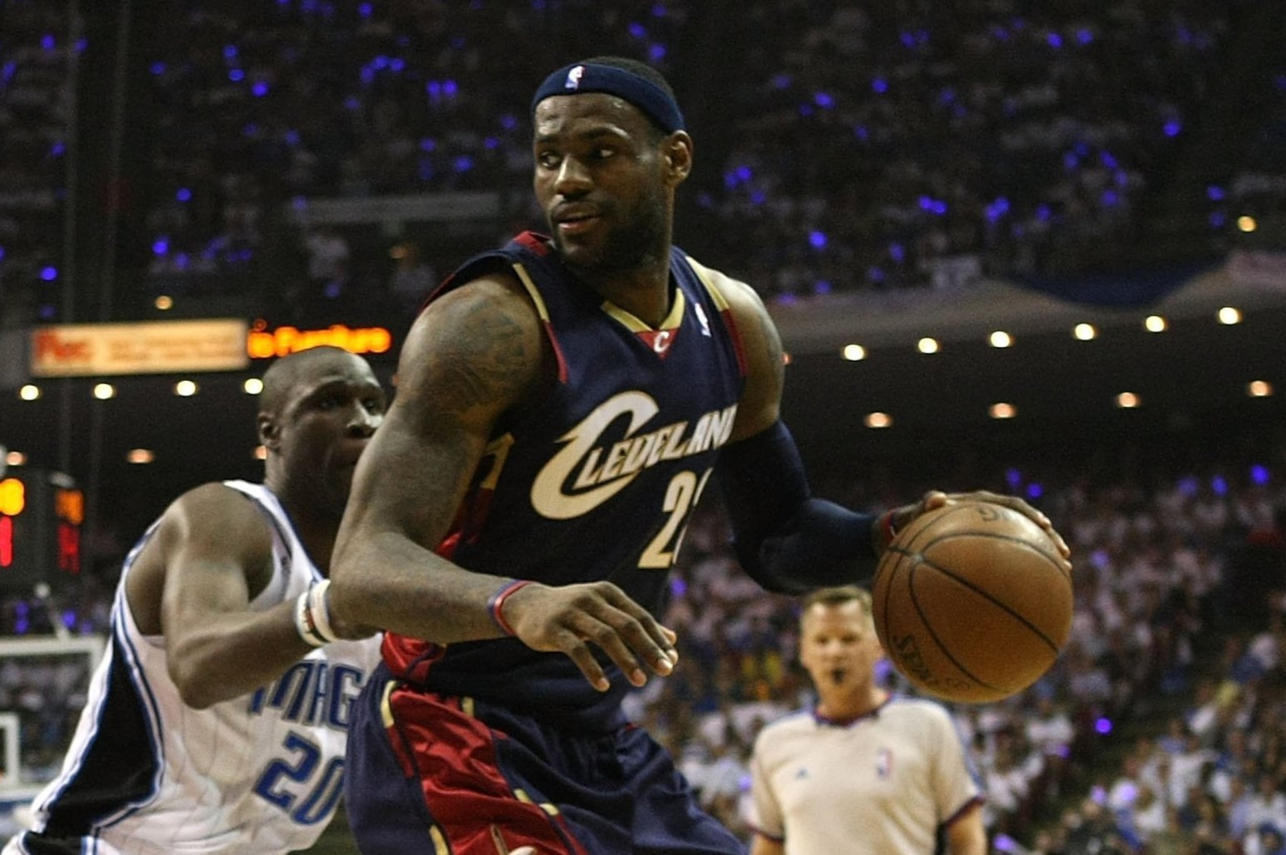 ORLANDO, FL - MAY 30: LeBron James #23 of the Cleveland Cavaliers handles the ball against Mickael Pietrus #20 and Dwight Howard #12 of the Orlando Magic in Game Six of the Eastern Conference Finals during the 2009 Playoffs at Amway Arena on May 30, 2009 