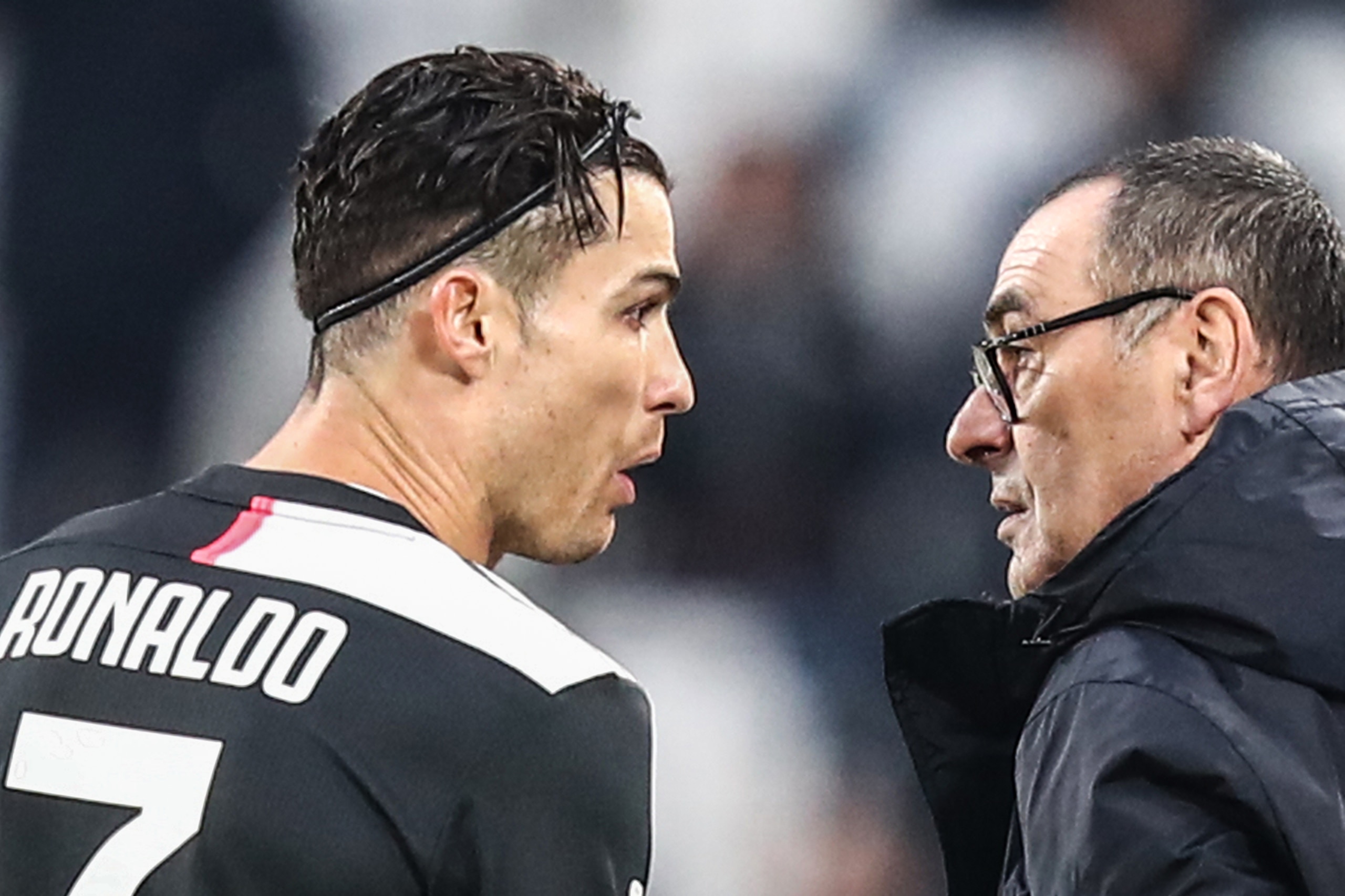 Juventus' Portuguese forward Cristiano Ronaldo (L) talks with Juventus' Italian coach Maurizio Sarri during the Italian Serie A football match Juventus vs Udinese on December 15, 2019 at the Juventus Allianz stadium in Turin. (Photo by Isabella BONOTTO / Juventus' Portuguese forward Cristiano Ronaldo (L) talks with Juventus' Italian coach Maurizio Sarri during the Italian Serie A football match Juventus vs Udinese on December 15, 2019 at the Juventus Allianz stadium in Turin. (Photo by Isabella BONOTTO /