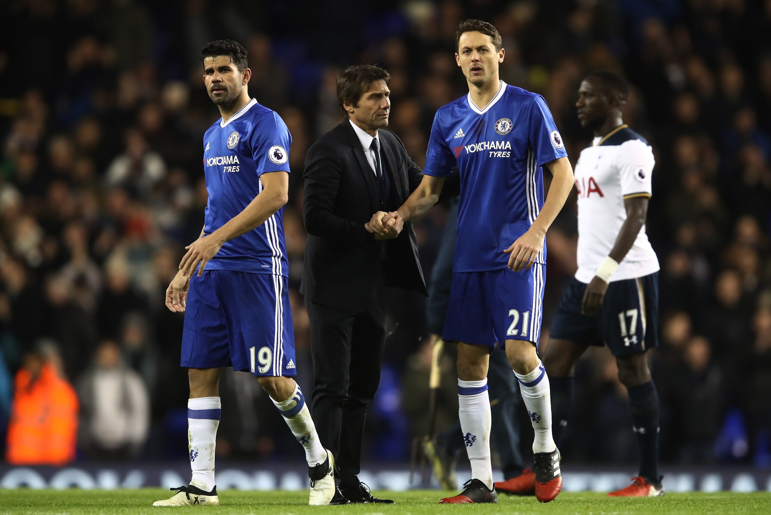 LONDON, ENGLAND - JANUARY 04: Antonio Conte, Manager of Chelsea (C) embrace Nemanja Matic of Chelsea (R) after the Premier League match between Tottenham Hotspur and Chelsea at White Hart Lane on January 4, 2017 in London, England.  (Photo by Julian Finne