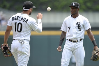 CHICAGO - JUNE 01:  Tim Anderson #7 tosses the baseball to Yoan Moncada #10 of the Chicago White Sox during the game against the Cleveland Indians on June 1, 2019 at Guaranteed Rate Field in Chicago, Illinois.  (Photo by Ron Vesely/MLB Photos via Getty Im