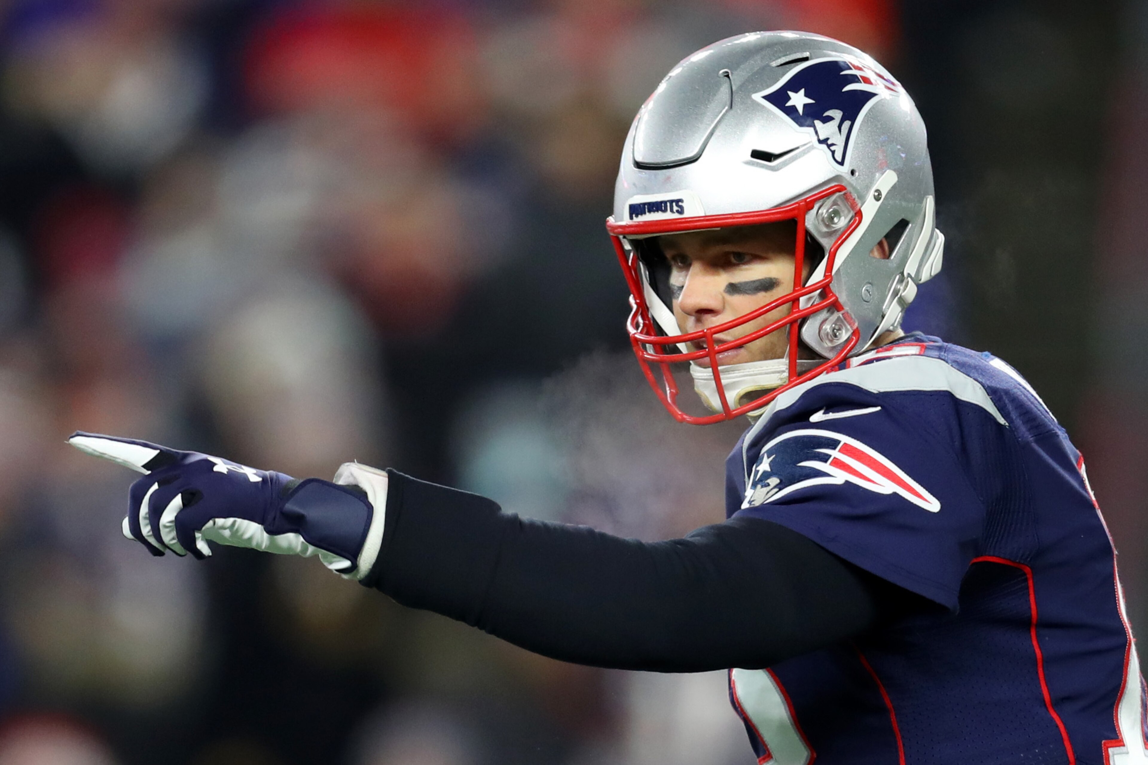 FOXBOROUGH, MASSACHUSETTS - DECEMBER 21: Tom Brady #12 of the New England Patriots directs his teammates during the game against the Buffalo Bills at Gillette Stadium on December 21, 2019 in Foxborough, Massachusetts. (Photo by Maddie Meyer/Getty Images)