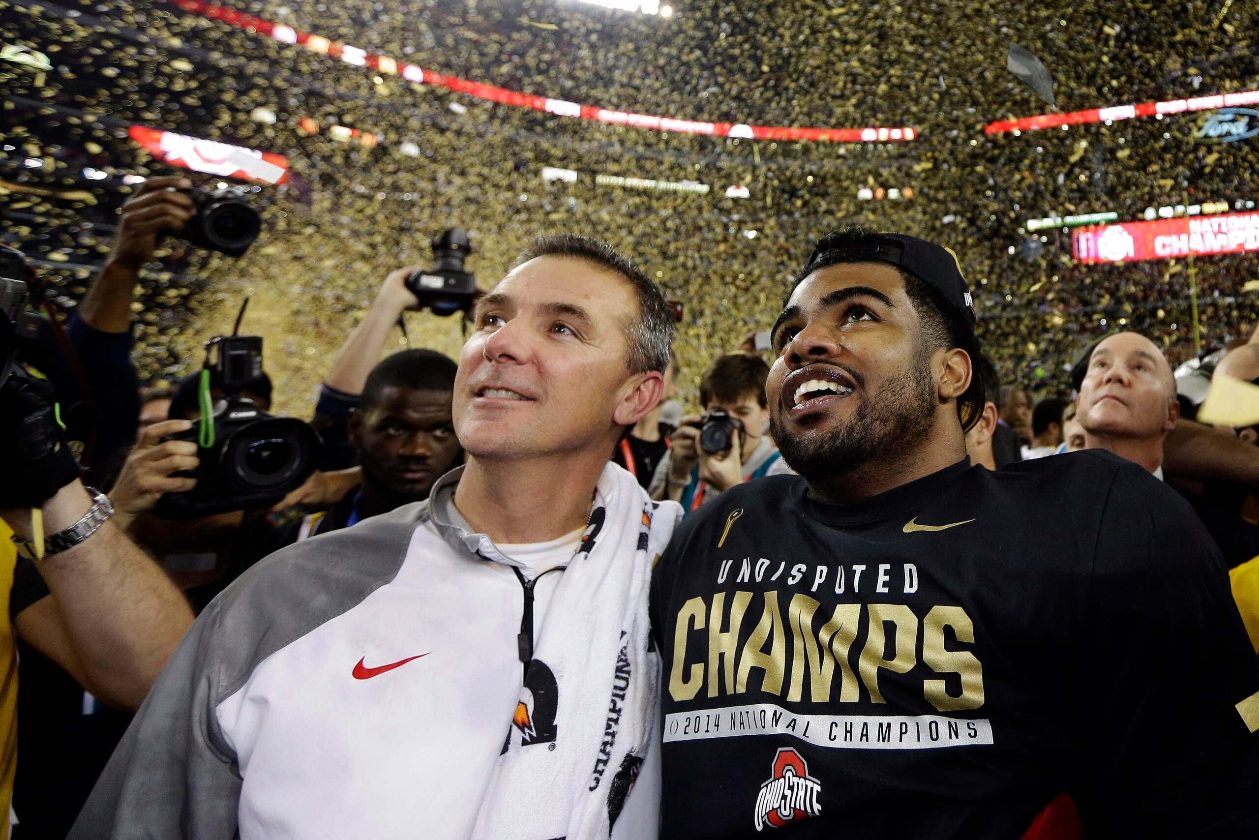 Ohio State's Urban Meyer and Ezekiel Elliott celebrate winning a title.