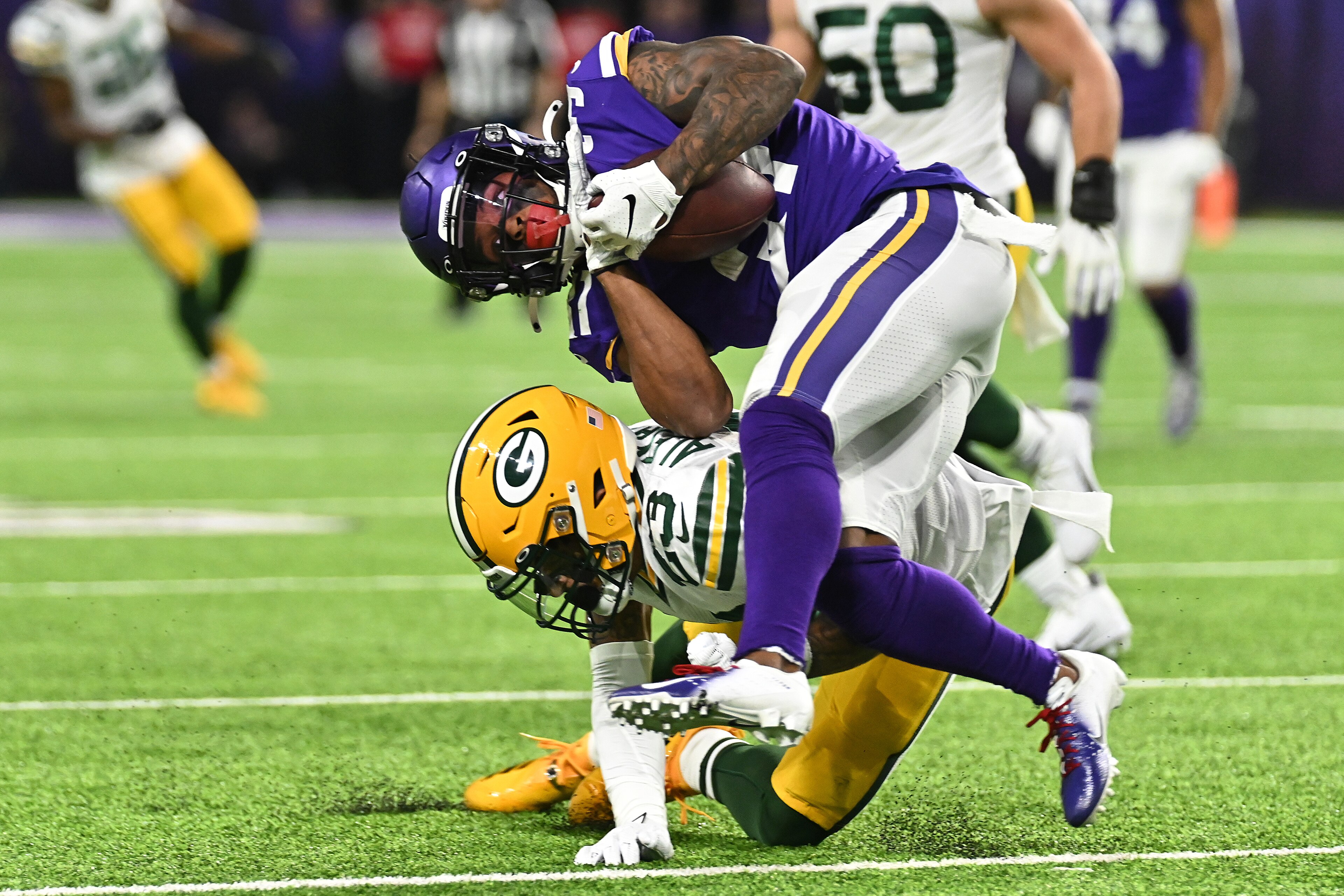 MINNEAPOLIS, MINNESOTA - DECEMBER 23: Cornerback Jaire Alexander #23 of the Green Bay Packers tackles running back Ameer Abdullah #31 of the Minnesota Vikings during the game at U.S. Bank Stadium on December 23, 2019 in Minneapolis, Minnesota. (Photo by MINNEAPOLIS, MINNESOTA - DECEMBER 23: Cornerback Jaire Alexander #23 of the Green Bay Packers tackles running back Ameer Abdullah #31 of the Minnesota Vikings during the game at U.S. Bank Stadium on December 23, 2019 in Minneapolis, Minnesota. (Photo by