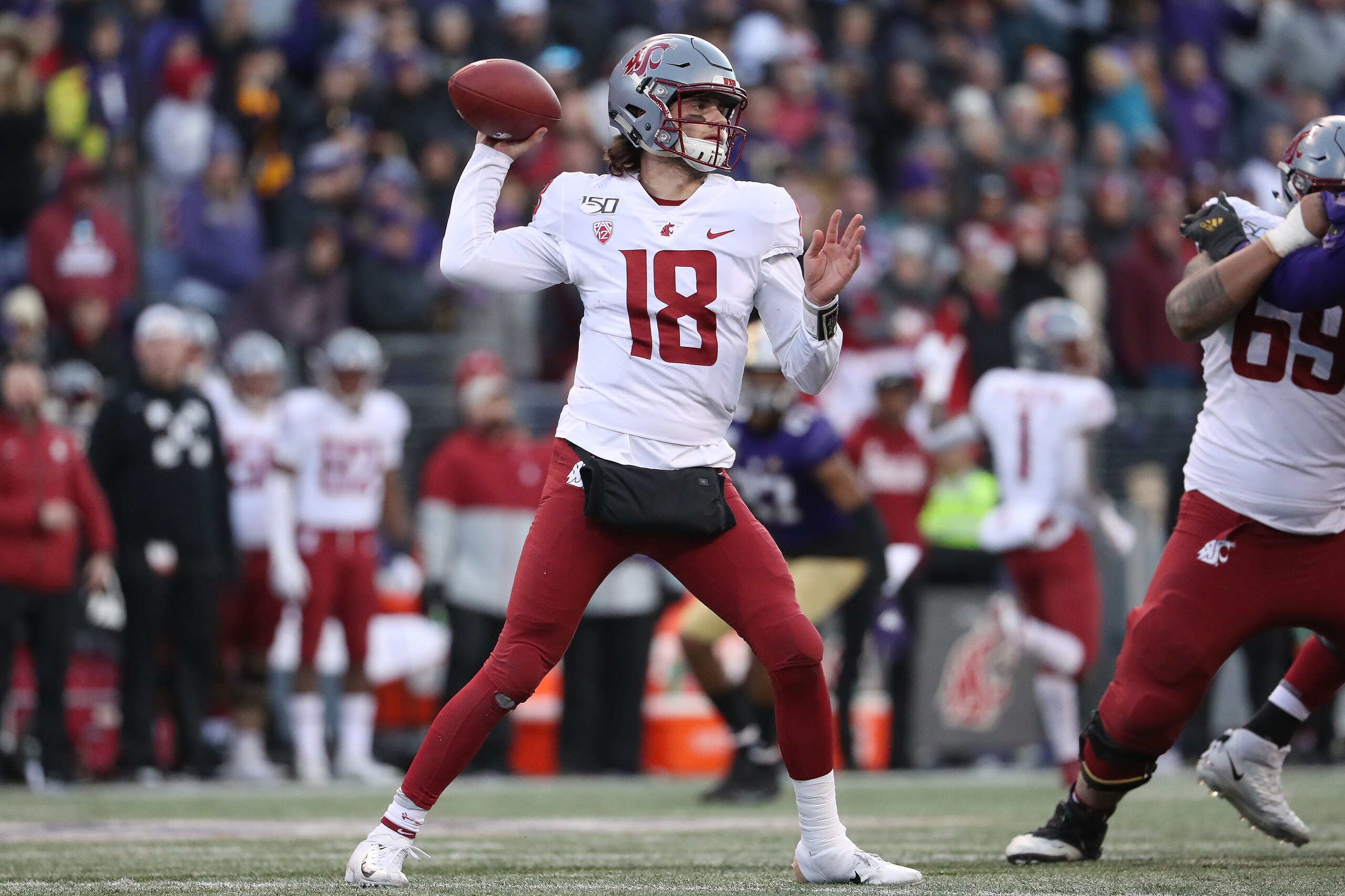 SEATTLE, WASHINGTON - NOVEMBER 29: Anthony Gordon #18 of the Washington State Cougars throws the ball against the Washington Huskies in the fourth quarter during their game at Husky Stadium on November 29, 2019 in Seattle, Washington. (Photo by Abbie Parr