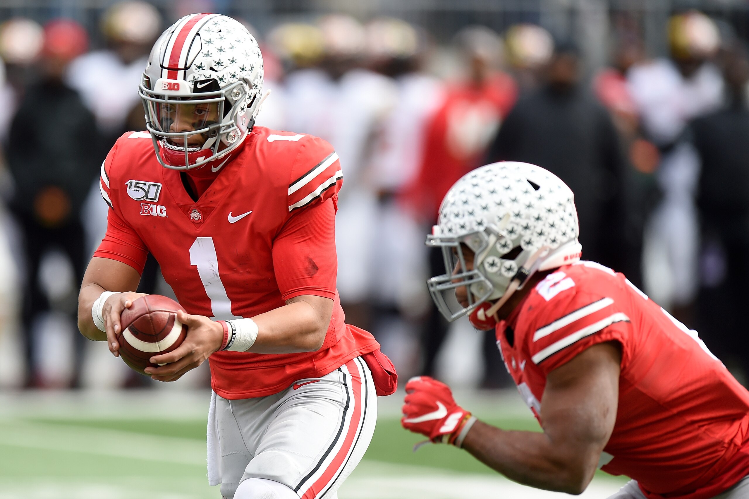 COLUMBUS, OH - NOVEMBER 09:  Justin Fields #1 of the Ohio State Buckeyes hands off the ball to J.K. Dobbins #2 during the game against the Maryland Terrapins at Ohio Stadium on November 9, 2019 in Columbus, Ohio.  (Photo by G Fiume/Maryland Terrapins/Gett