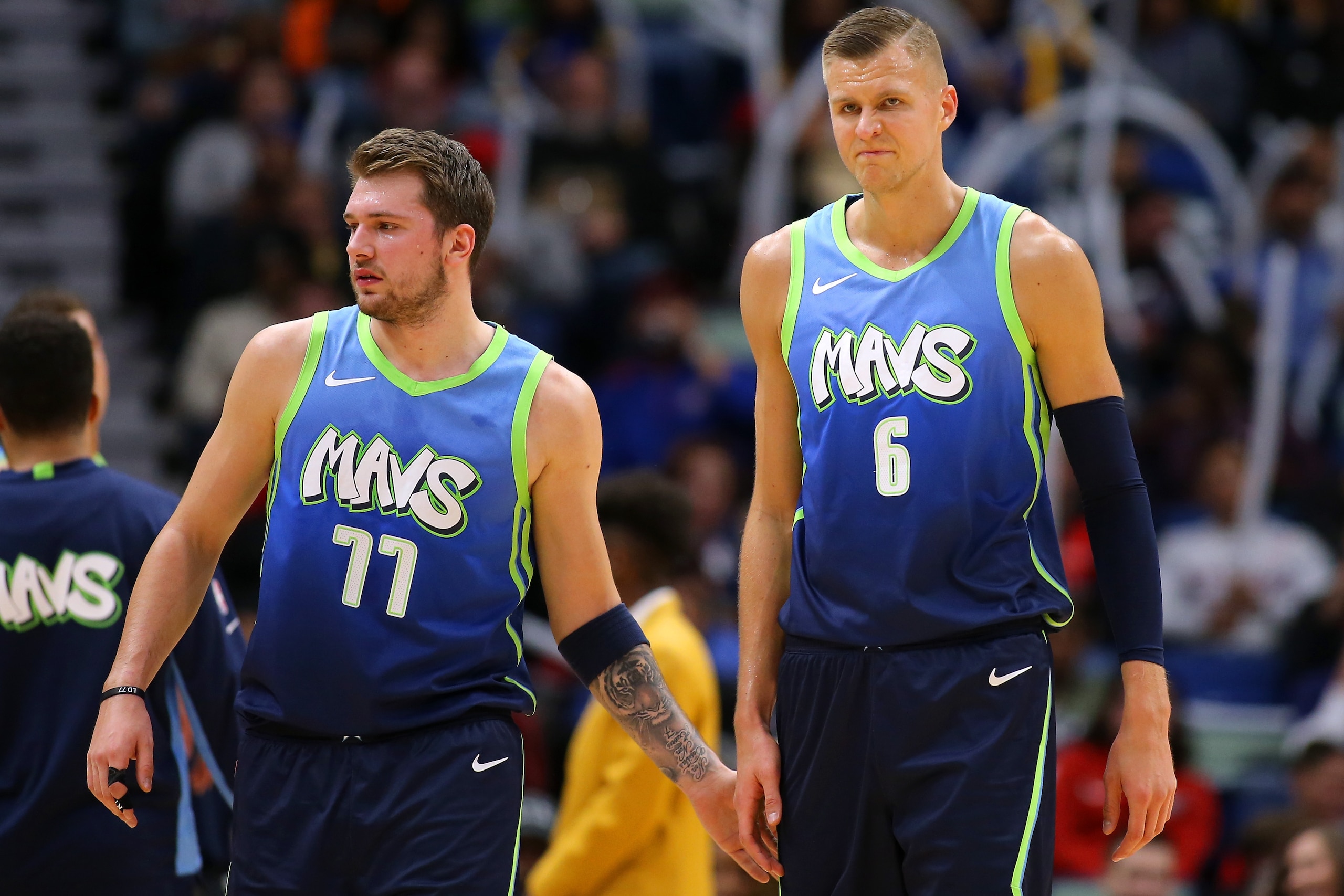 NEW ORLEANS, LOUISIANA - DECEMBER 03: Luka Doncic #77 of the Dallas Mavericks and Kristaps Porzingis #6 react against the New Orleans Pelicans during the first half at the Smoothie King Center on December 03, 2019 in New Orleans, Louisiana. NOTE TO USER: 