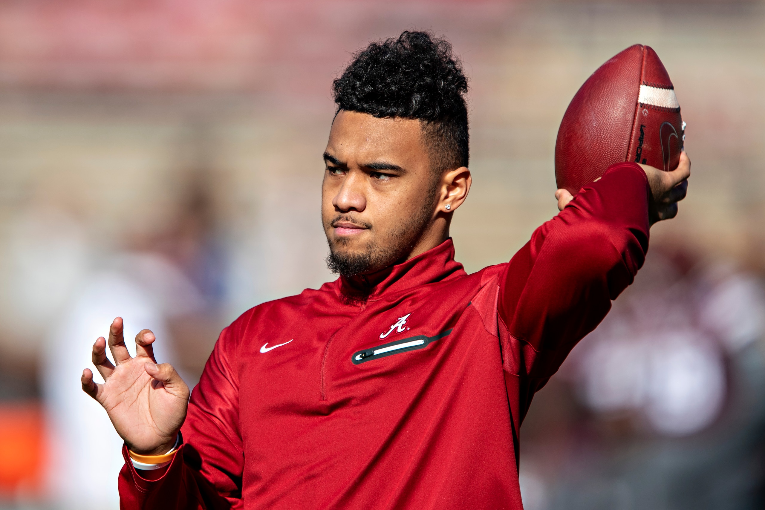 FAYETTEVILLE, AR - NOVEMBER 9:   Tua Tagovailoa #13 of the Alabama Crimson Tide warms up before a game against the Mississippi State Bulldogs at Davis Wade Stadium on November 16, 2019 in Starkville, Mississippi.  The Crimson Tide defeated the Bulldogs 38