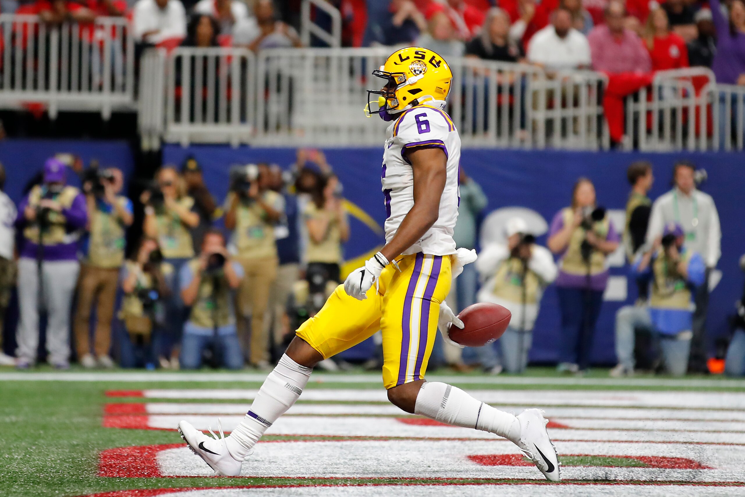 ATLANTA, GEORGIA - DECEMBER 07: Terrace Marshall Jr. #6 of the LSU Tigers scores a touchdown in the third quarter against the Georgia Bulldogs during the SEC Championship game at Mercedes-Benz Stadium on December 07, 2019 in Atlanta, Georgia. (Photo by To