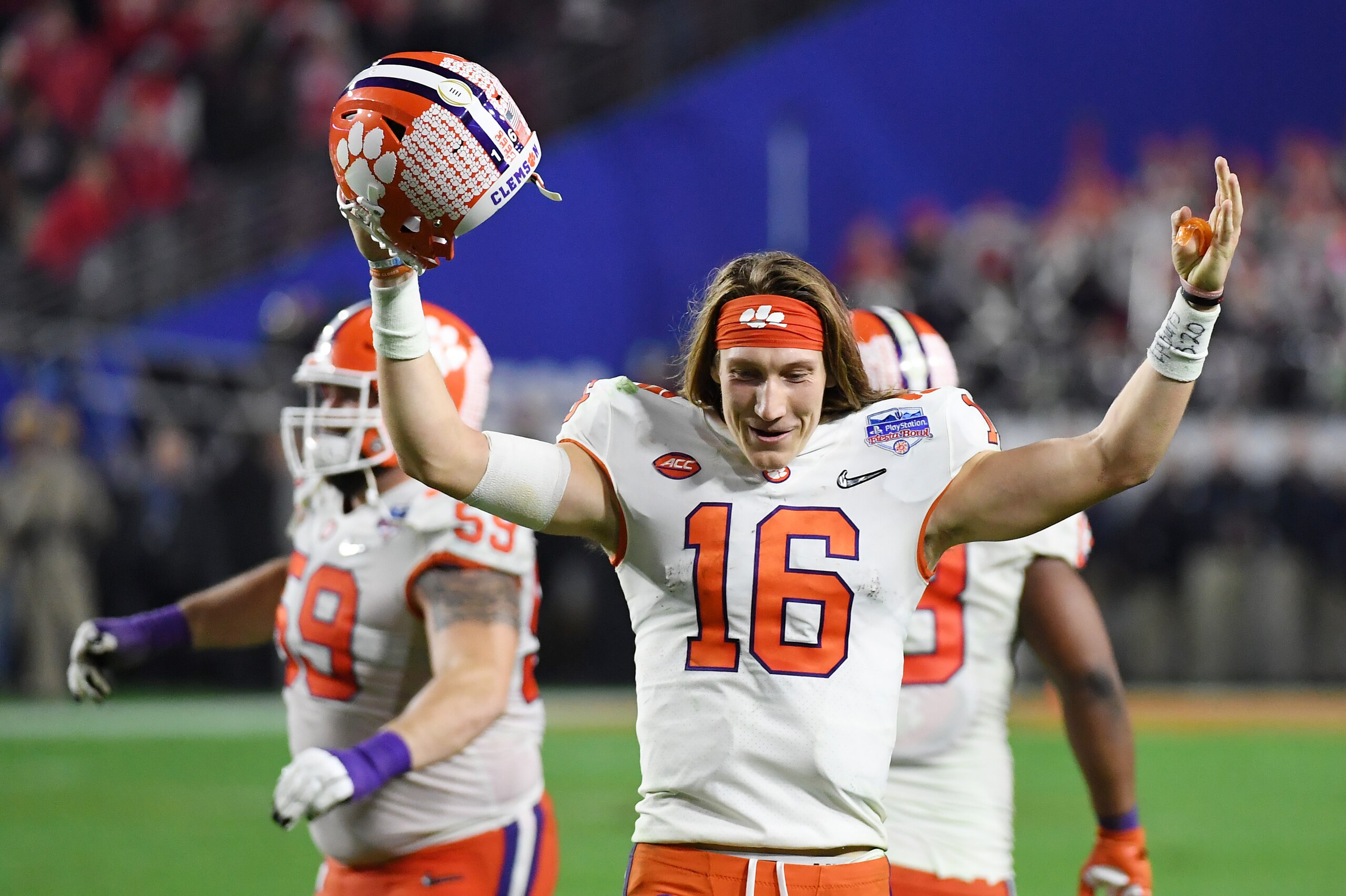 GLENDALE, ARIZONA - DECEMBER 28:  Trevor Lawrence #16 of the Clemson Tigers celebrates his teams 29-23 win over the Ohio State Buckeyes in the College Football Playoff Semifinal at the PlayStation Fiesta Bowl at State Farm Stadium on December 28, 2019 in 