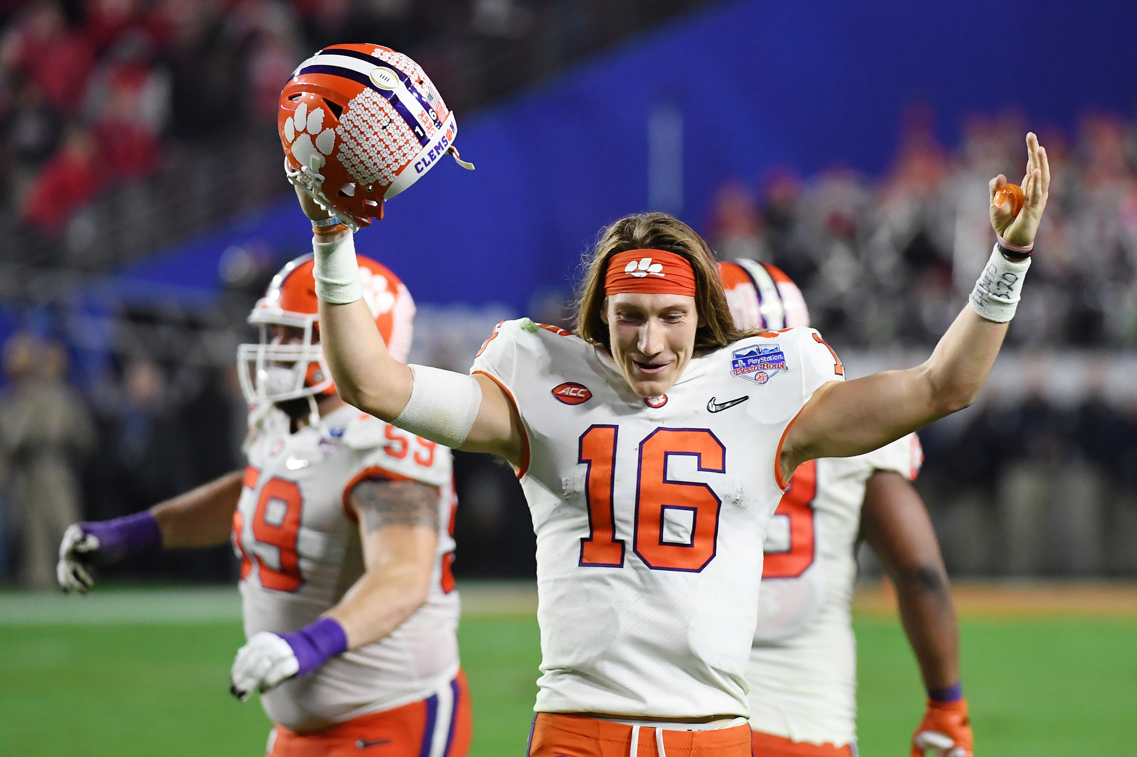 GLENDALE, ARIZONA - DECEMBER 28: Trevor Lawrence #16 of the Clemson Tigers celebrates his teams 29-23 win over the Ohio State Buckeyes in the College Football Playoff Semifinal at the PlayStation Fiesta Bowl at State Farm Stadium on December 28, 2019 in GLENDALE, ARIZONA - DECEMBER 28: Trevor Lawrence #16 of the Clemson Tigers celebrates his teams 29-23 win over the Ohio State Buckeyes in the College Football Playoff Semifinal at the PlayStation Fiesta Bowl at State Farm Stadium on December 28, 2019 in