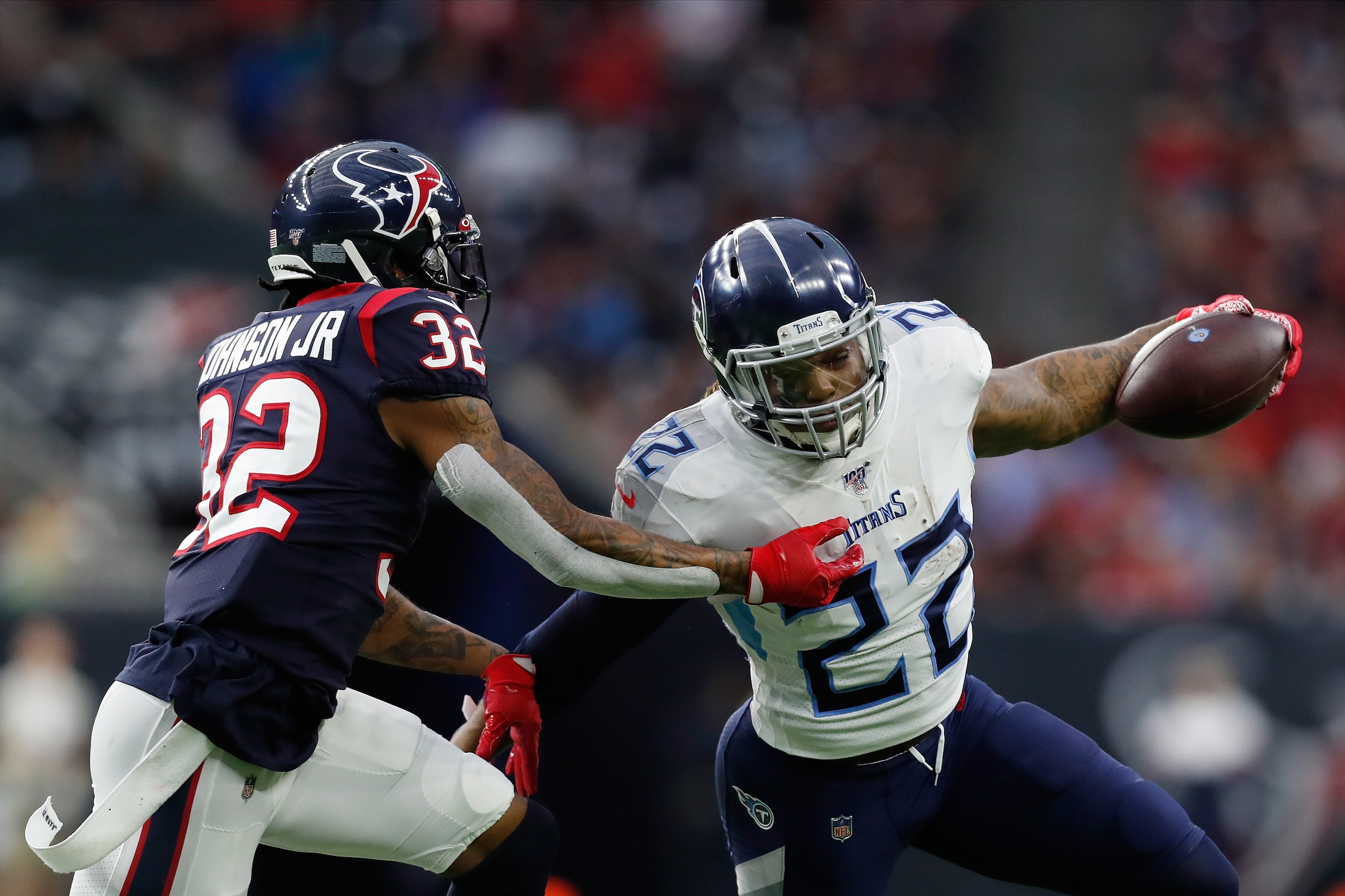 HOUSTON, TEXAS - DECEMBER 29: Derrick Henry #22 of the Tennessee Titans is pursued by Lonnie Johnson #32 of the Houston Texans during the first half at NRG Stadium on December 29, 2019 in Houston, Texas. (Photo by Tim Warner/Getty Images) HOUSTON, TEXAS - DECEMBER 29: Derrick Henry #22 of the Tennessee Titans is pursued by Lonnie Johnson #32 of the Houston Texans during the first half at NRG Stadium on December 29, 2019 in Houston, Texas. (Photo by Tim Warner/Getty Images)