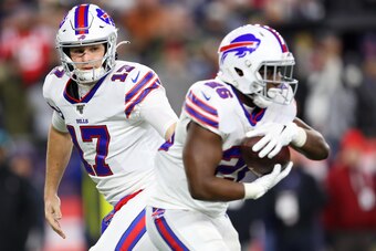 FOXBOROUGH, MASSACHUSETTS - DECEMBER 21: Josh Allen #17 of the Buffalo Bills hands the ball off to Devin Singletary #26 at Gillette Stadium on December 21, 2019 in Foxborough, Massachusetts. (Photo by Maddie Meyer/Getty Images)