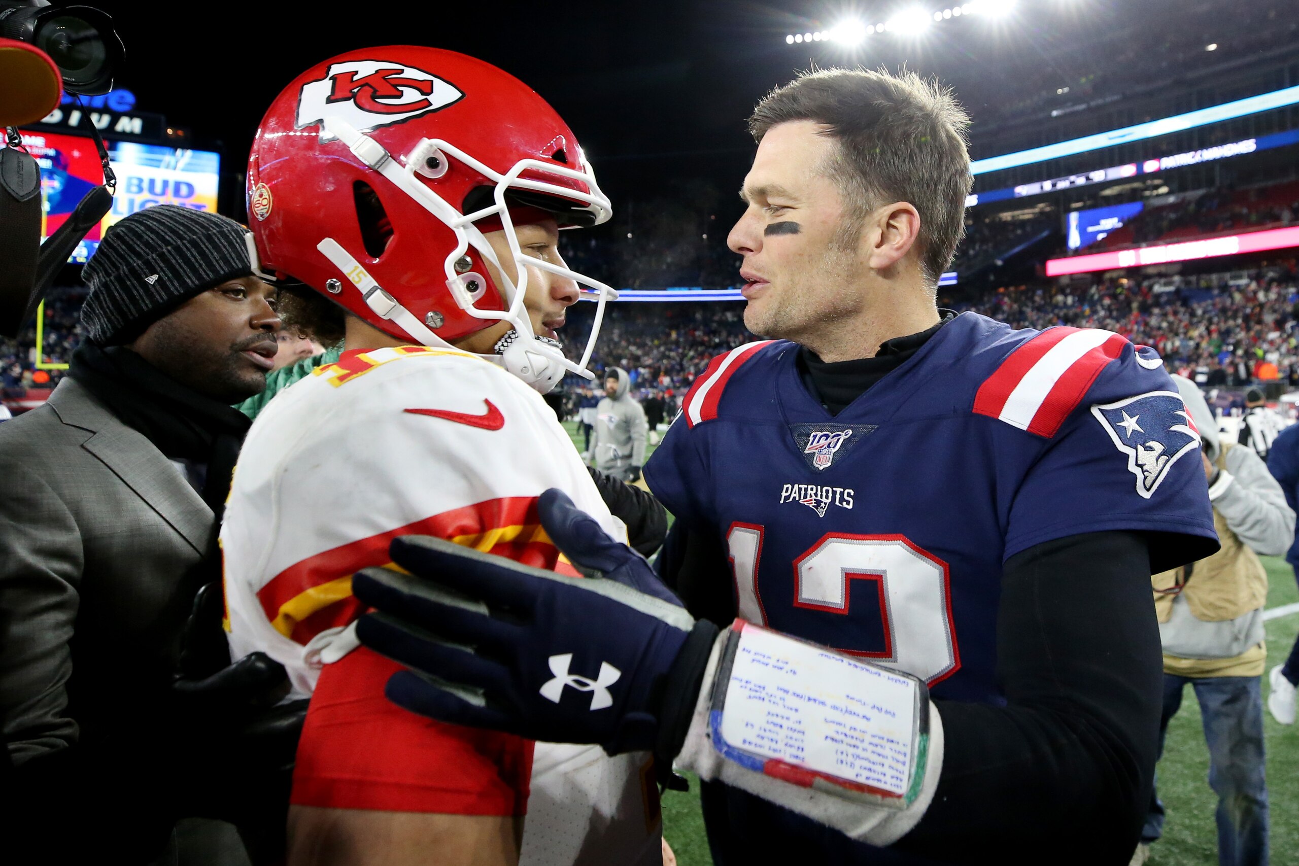 FOXBOROUGH, MASSACHUSETTS - DECEMBER 08: Tom Brady #12 of the New England Patriots talks with Patrick Mahomes #15 of the Kansas City Chiefs after the Chief defeat the Patriots 23-16 at Gillette Stadium on December 08, 2019 in Foxborough, Massachusetts. (P