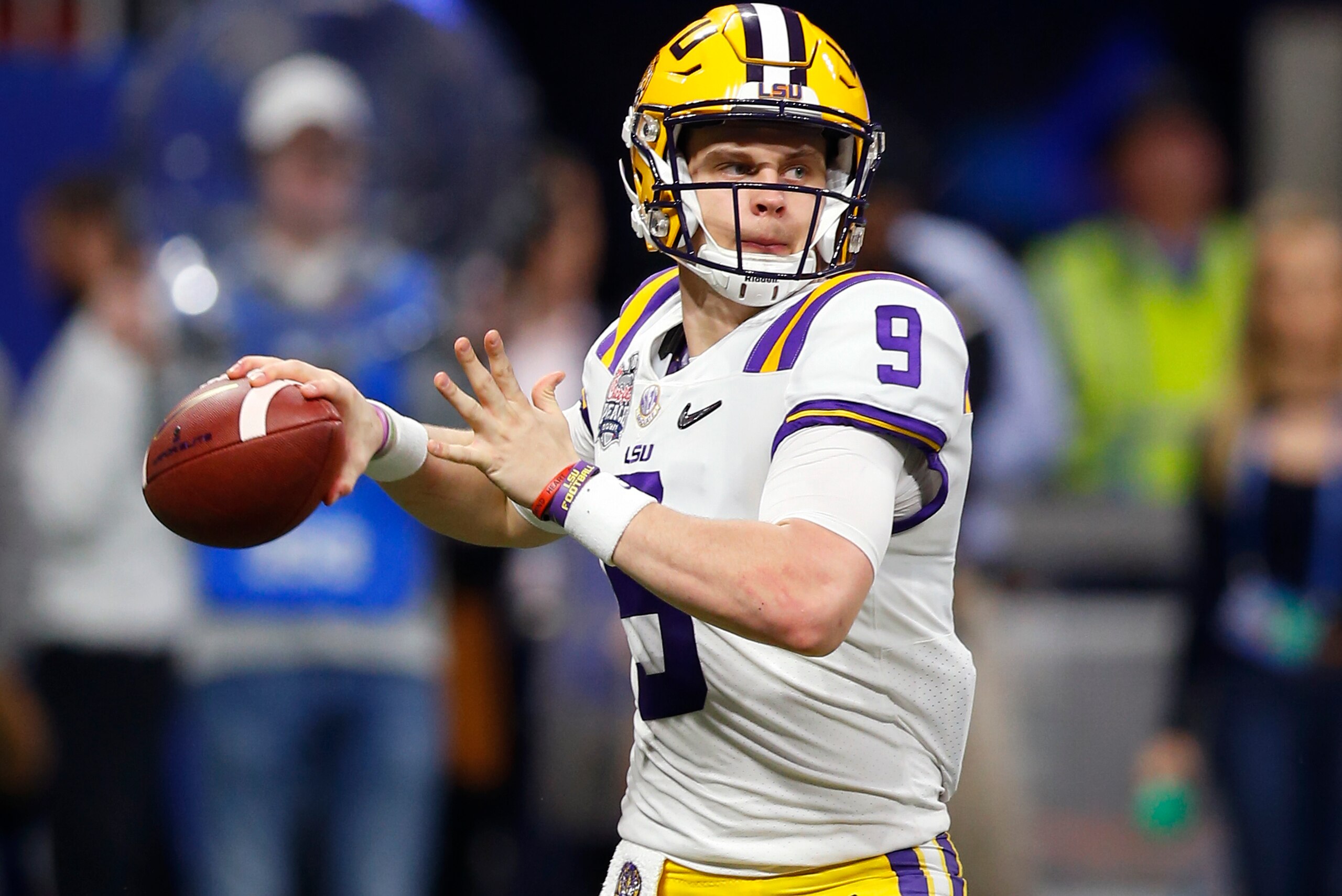 ATLANTA, GEORGIA - DECEMBER 28: Quarterback Joe Burrow #9 of the LSU Tigers throws a pass during the College Football Playoff Semifinal at the Chick-fil-A Peach Bowl against the Oklahoma Sooners at Mercedes-Benz Stadium on December 28, 2019 in Atlanta, Ge