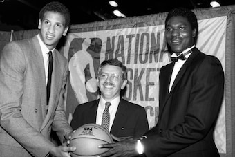 David Stern, here with Sam Bowie and Hakeem Olajuwon at the 1984 draft, became the NBA's fourth commissioner earlier that year.