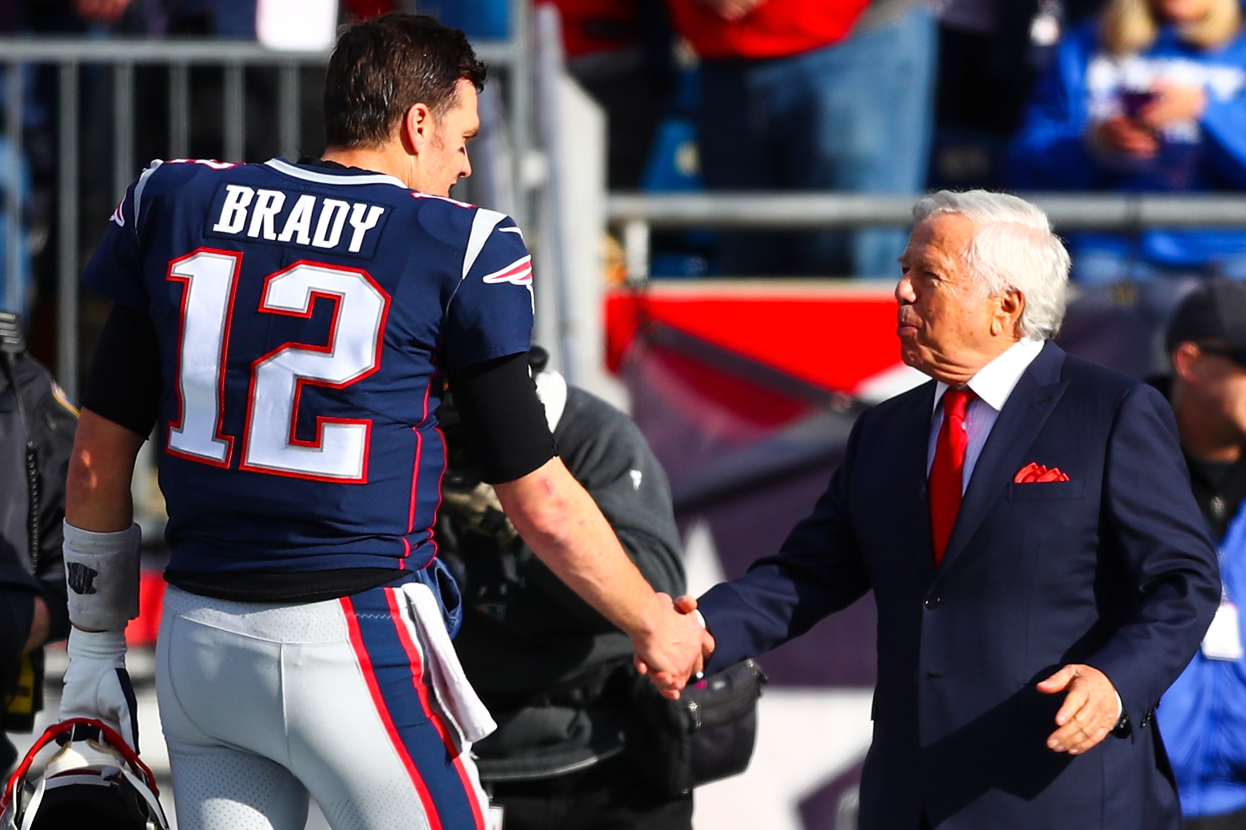 FOXBOROUGH, MA - DECEMBER 29:   Tom Brady #12 shakes the hand of owner Robert Kraft of the New England Patriots before a game against the Miami Dolphins at Gillette Stadium on December 29, 2019 in Foxborough, Massachusetts.  (Photo by Adam Glanzman/Getty 
