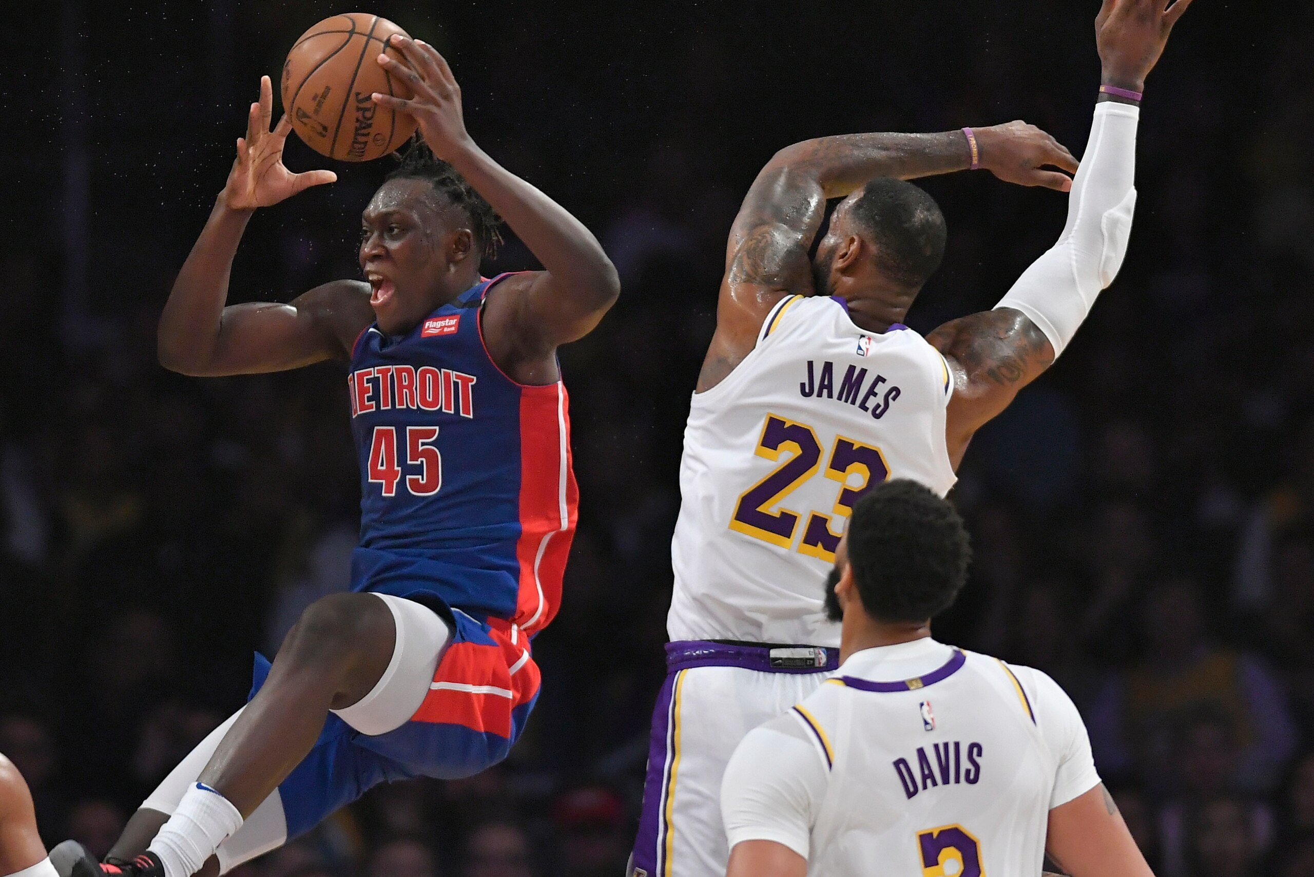 LOS ANGELES, CA - JANUARY 05: Sekou Doumbouya #45 of the Detroit Pistons reacts to being fouled by LeBron James #23 as Anthony Davis #3 of the Los Angeles Lakers looks on in the second half at Staples Center on January 5, 2020 in Los Angeles, California. 