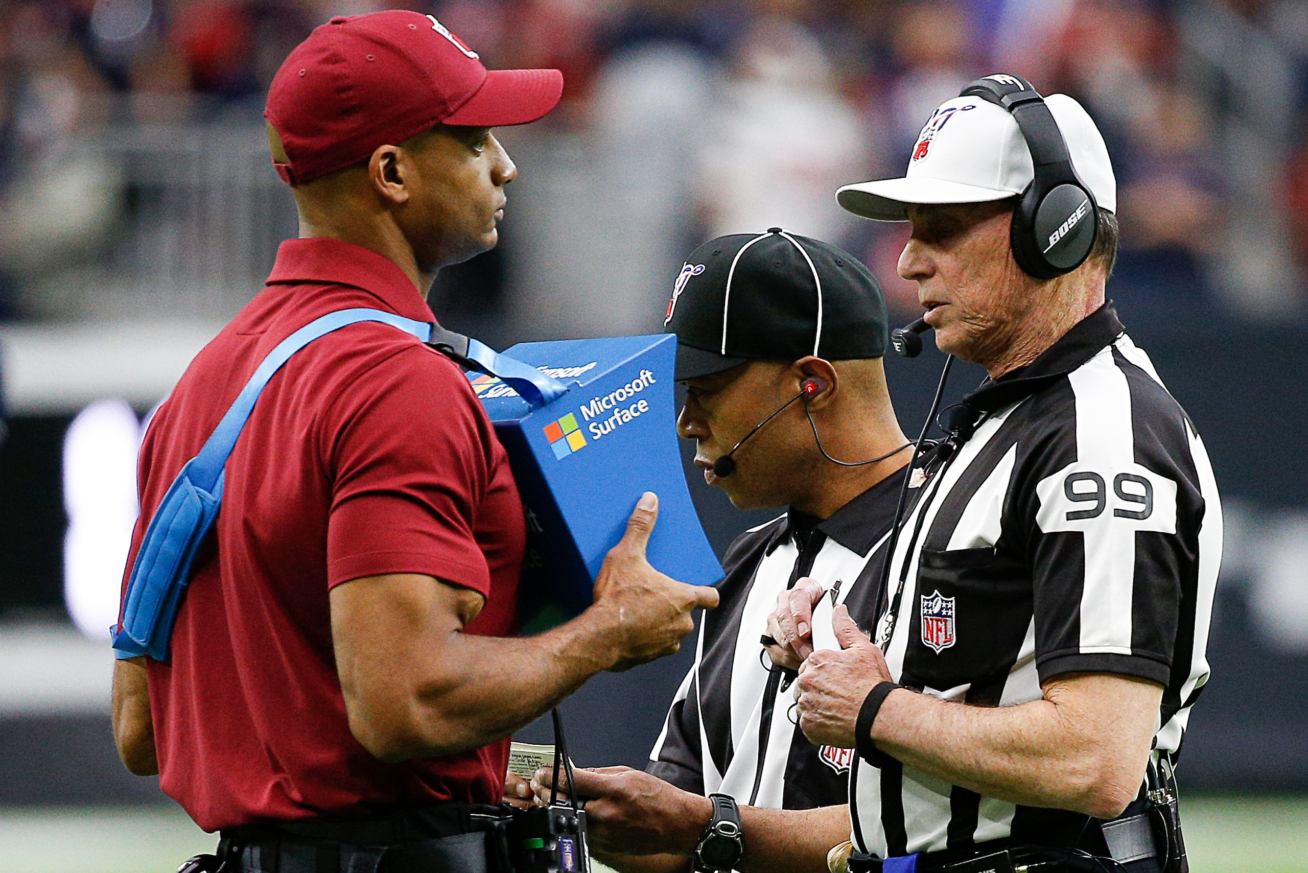 HOUSTON, TEXAS - JANUARY 04: Referee Tony Corrente #99 reviews a play during the AFC Wild Card Playoff game at NRG Stadium on January 04, 2020 in Houston, Houston won 22-19 in overtime. (Photo by Bob Levey/Getty Images)