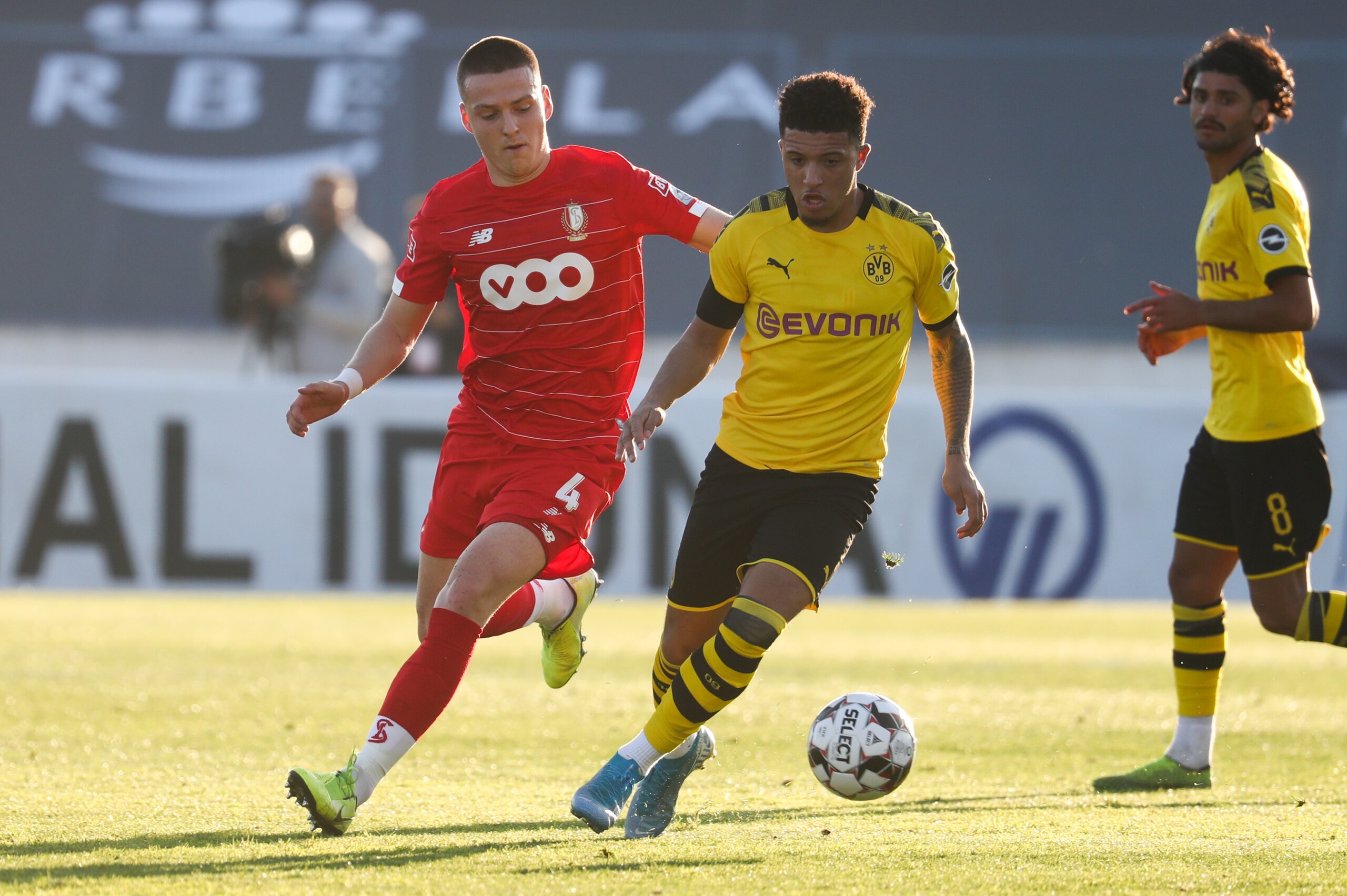 Standard's Dimitri Lavalee and Dortmund's Jadon Sancho fight for the ball during a friendly soccer game between Belgian team Standard de Liege and German club Borussia Dortmund at their the winter training camps in Marbella, Spain, Tuesday 07 January 2020