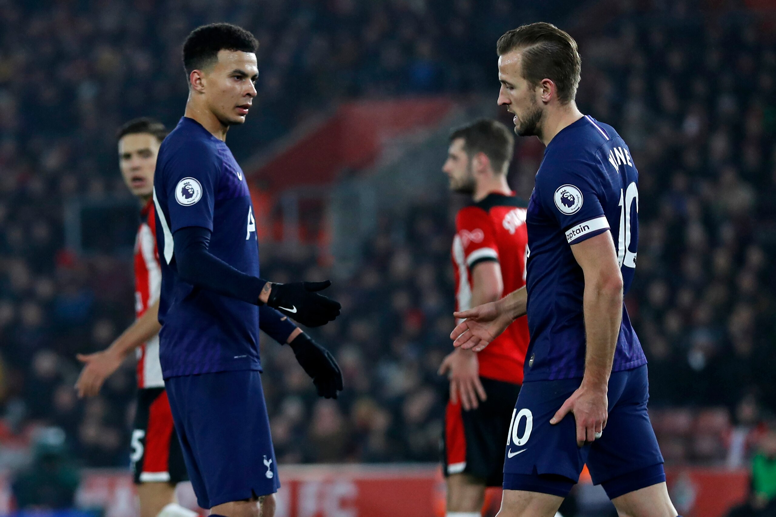 Tottenham Hotspur's English midfielder Dele Alli (L) checks on Tottenham Hotspur's English striker Harry Kane (R) after he appears to have picked up an injury during the English Premier League football match between Southampton and Tottenham at St Mary's 