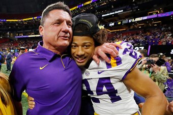ATLANTA, GEORGIA - DECEMBER 07: Head coach Ed Orgeron of the LSU Tigers celebrates with Derek Stingley Jr. #24 after defeating the Georgia Bulldogs 37-10 to win the SEC Championship game at Mercedes-Benz Stadium on December 07, 2019 in Atlanta, Georgia. (