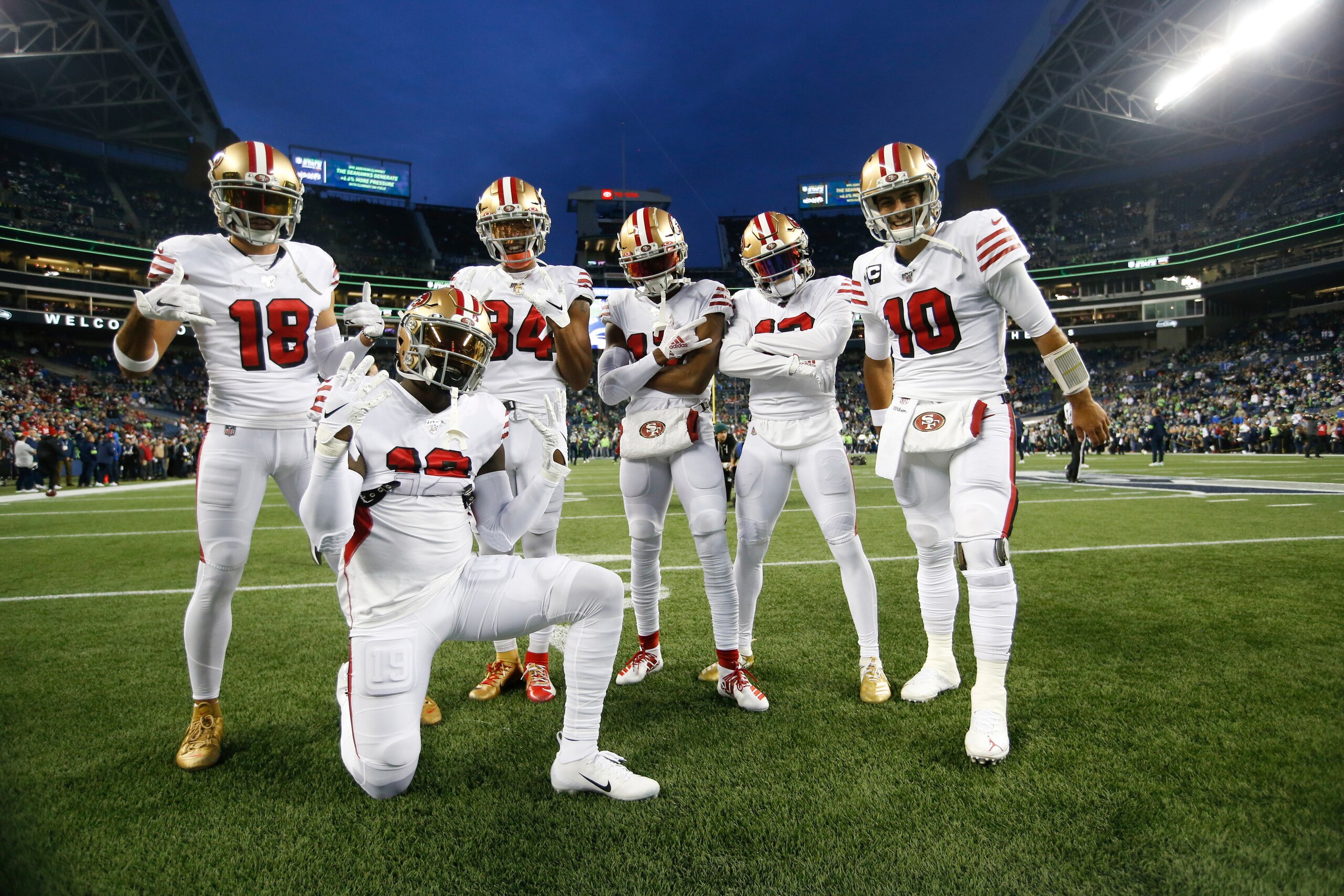 SEATTLE, WA - DECEMBER 29: Dante Pettis #18, Deebo Samuel #19, Kendrick Bourne #84 Emmanuel Sanders #17, Richie James Jr. #13 and Jimmy Garoppolo #10 of the San Francisco 49ers pose for a photo on the field prior to game against the Seattle Seahawks at Ce