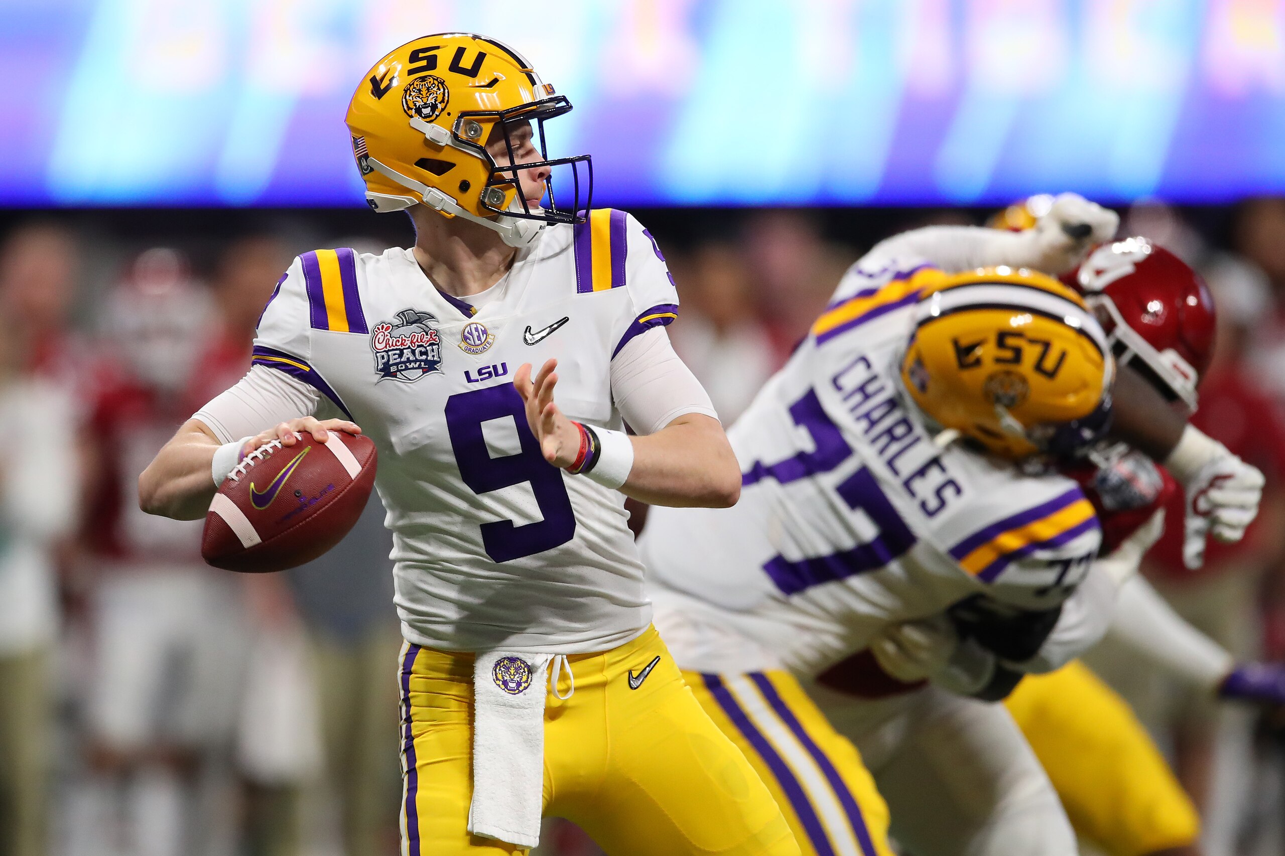 ATLANTA, GEORGIA - DECEMBER 28: Joe Burrow #9 of the LSU Tigers plays against the Oklahoma Sooners during the College Football Playoff Semifinal in the Chick-fil-A Peach Bowl at Mercedes-Benz Stadium on December 28, 2019 in Atlanta, Georgia. (Photo by Gre
