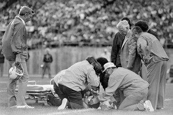 Patriots receiver Darryl Stingley, Derek Jr.'s grandfather, is attended after suffering a paralyzing blow in a 1978 preseason game.