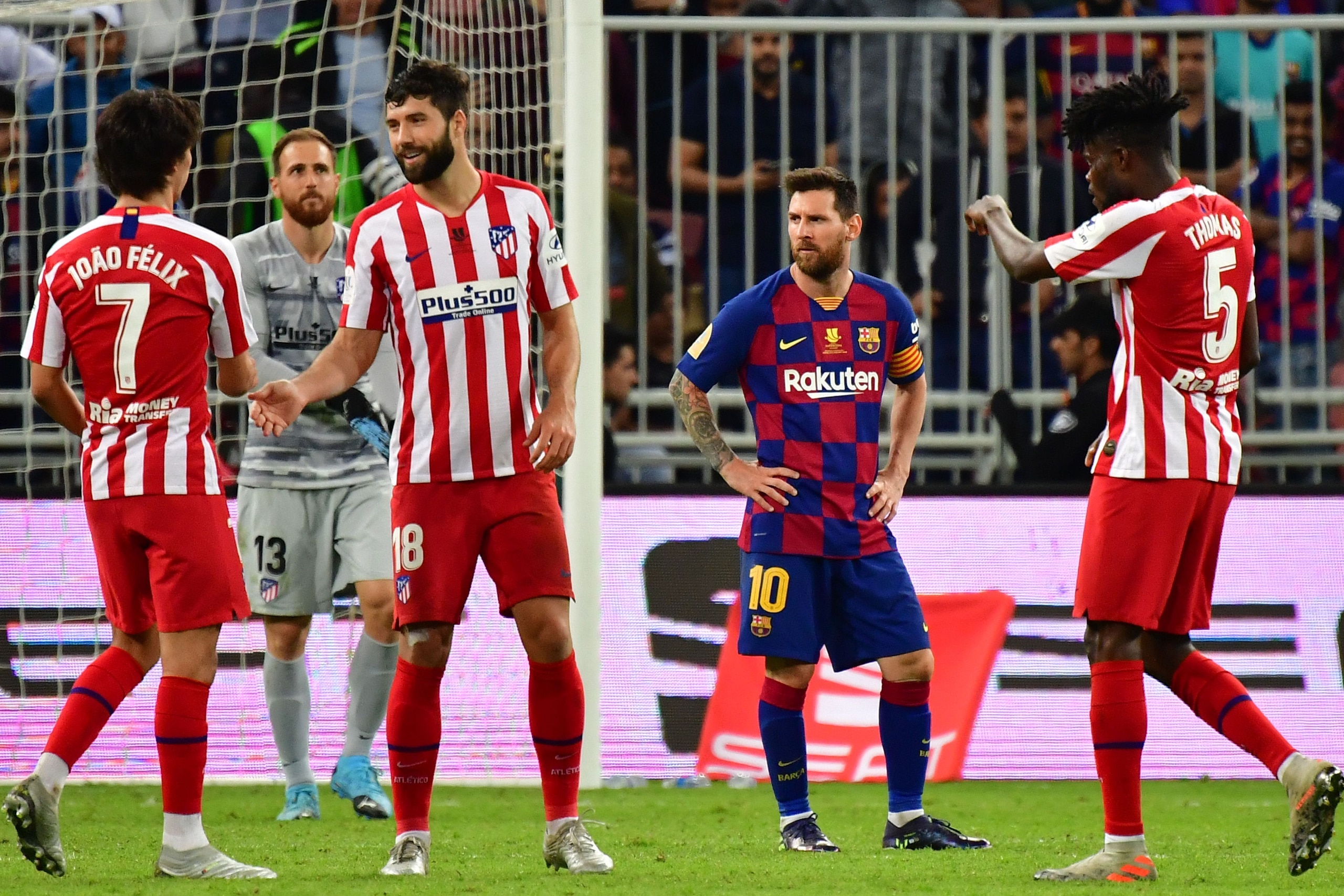 TOPSHOT - Barcelona's Argentine forward Lionel Messi (2nd-R) react to the loss following the Spanish Super Cup semi final between Barcelona and Atletico Madrid on January 9, 2020, at the King Abdullah Sport City in the Saudi Arabian port city of Jeddah. -
