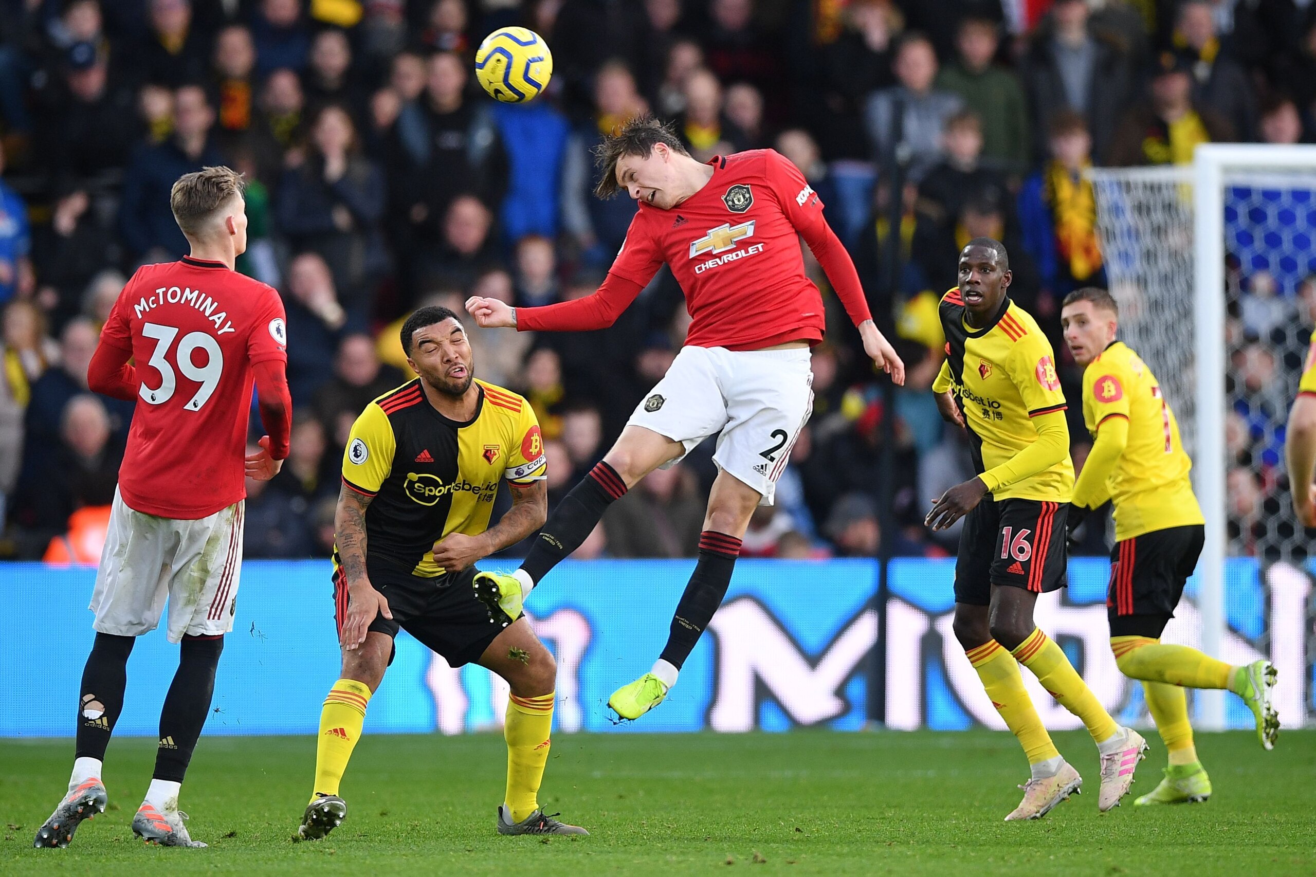 Manchester United's Swedish defender Victor Lindelof (C) jumps to win a header during the English Premier League football match between Watford and Manchester United at Vicarage Road Stadium in Watford, north of London on December 22, 2019. (Photo by DANI