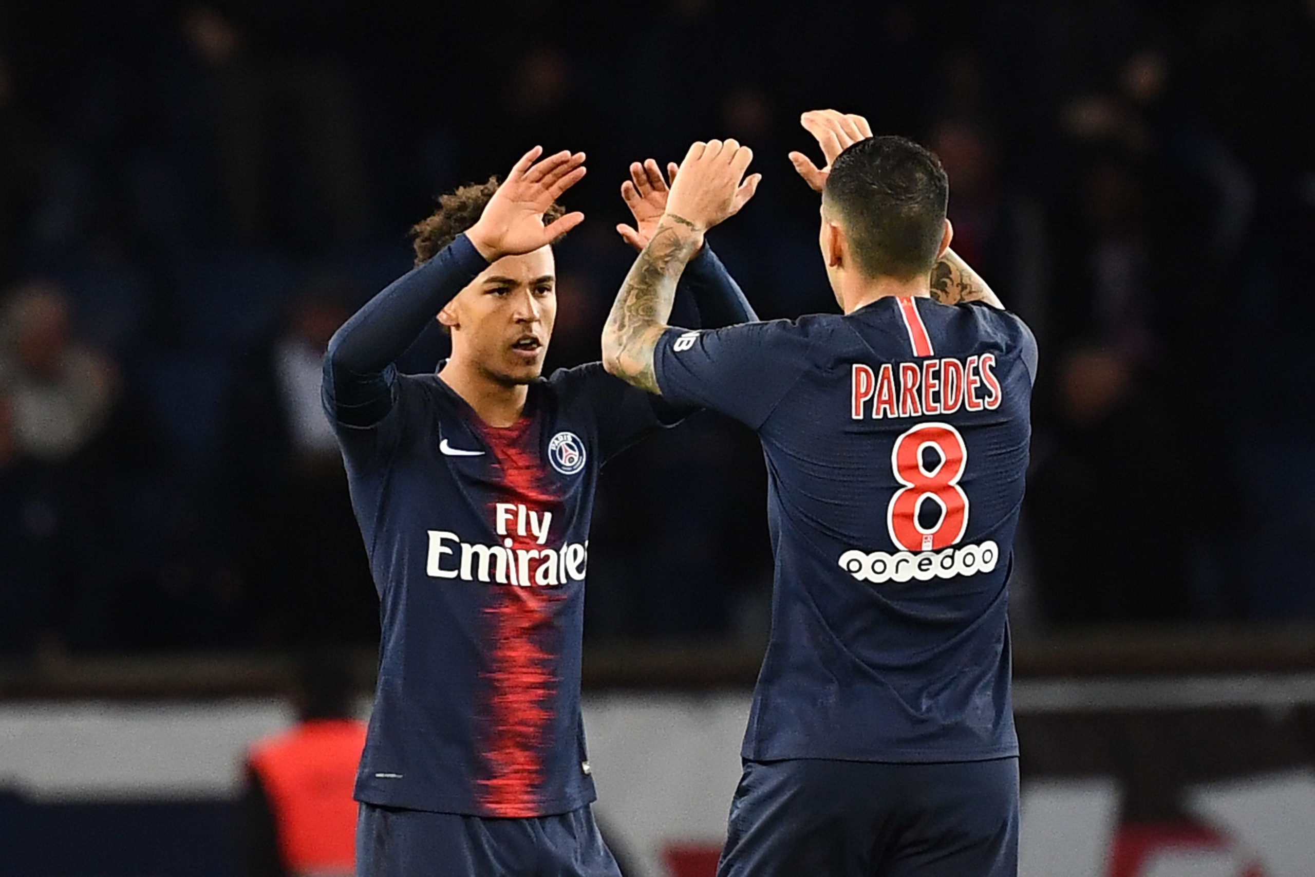Paris Saint-Germain's German defender Thilo Kehrer (L) celebrates with Paris Saint-Germain's Argentine midfielder Leandro Paredes (R) after scoring a goal during the French L1 football match Paris Saint-Germain (PSG) vs Strasbourg, on April 7, 2019 at the