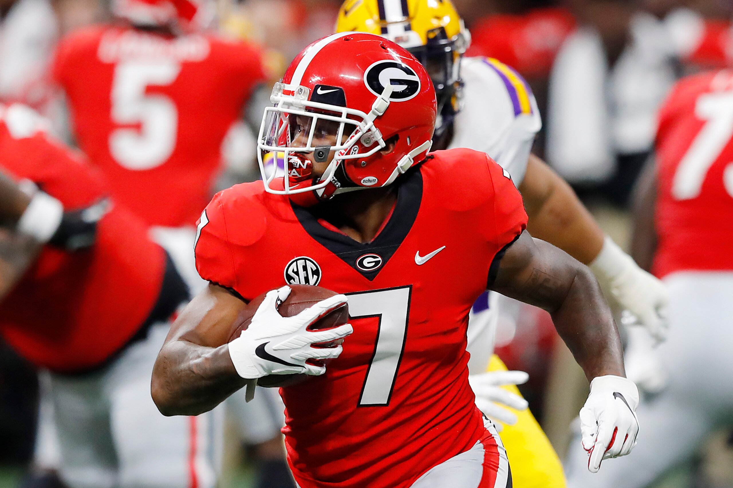 ATLANTA, GEORGIA - DECEMBER 07: D'Andre Swift #7 of the Georgia Bulldogs runs with the ball in the first half against the LSU Tigers during the SEC Championship game at Mercedes-Benz Stadium on December 07, 2019 in Atlanta, Georgia. (Photo by Kevin C. Cox