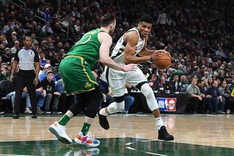MILWAUKEE, WISCONSIN - JANUARY 16:  Giannis Antetokounmpo #34 of the Milwaukee Bucks is defended by Gordon Hayward #20 of the Boston Celtics during the second half of a game at Fiserv Forum on January 16, 2020 in Milwaukee, Wisconsin. NOTE TO USER: User e