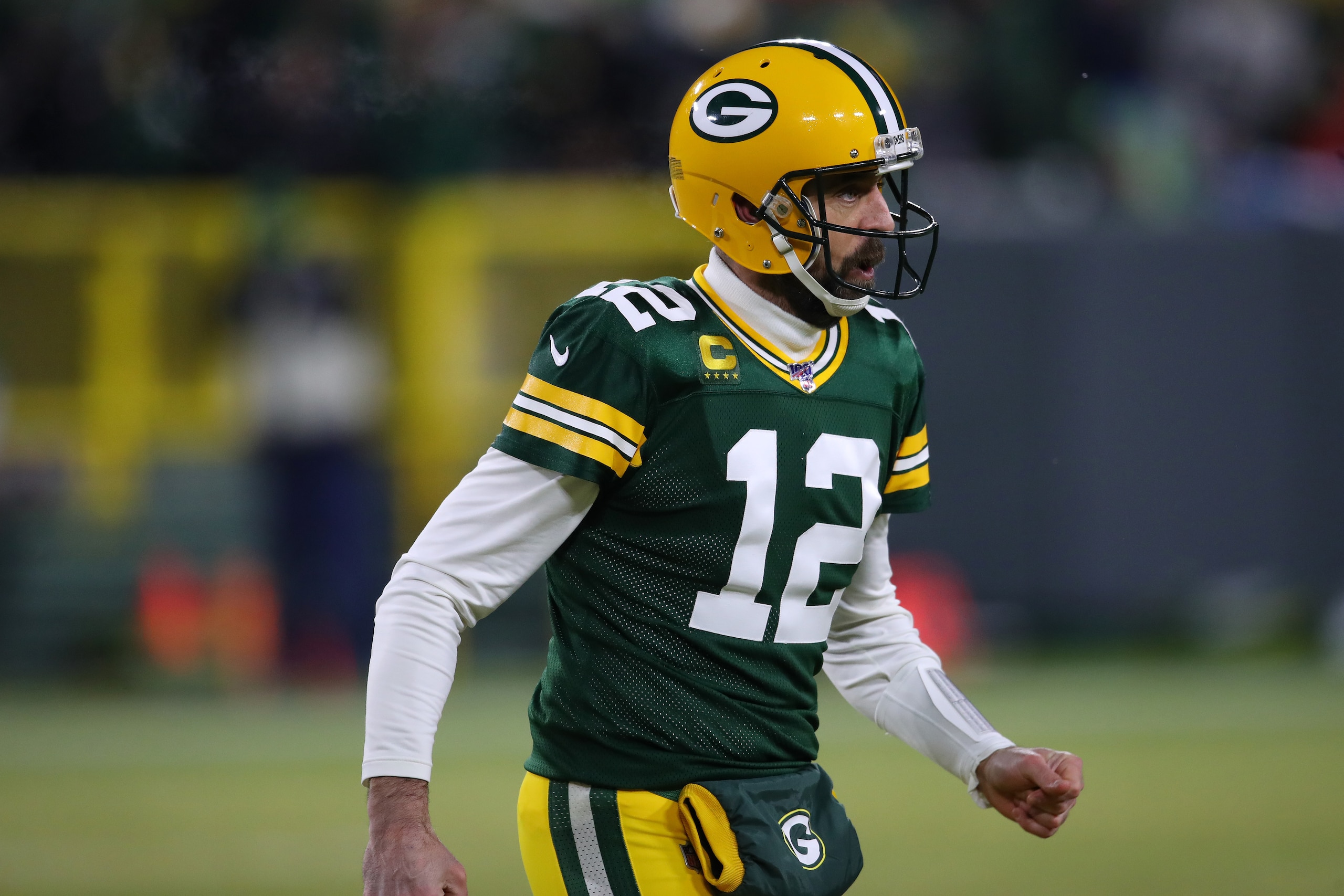 GREEN BAY, WISCONSIN - JANUARY 12: Aaron Rodgers #12 of the Green Bay Packers plays against the Seattle Seahawks during the NFC divisional round of the playoffs at Lambeau Field on January 12, 2020 in Green Bay, Wisconsin. (Photo by Gregory Shamus/Getty I