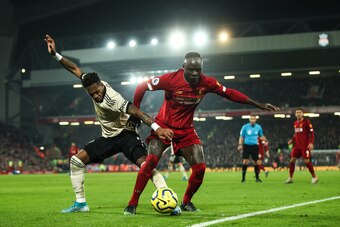 LIVERPOOL, ENGLAND - JANUARY 19: Fred of Manchester United and Sadio Mane of Liverpool during the Premier League match between Liverpool FC and Manchester United at Anfield on January 19, 2020 in Liverpool, United Kingdom. (Photo by Matthew Ashton - AMA/G