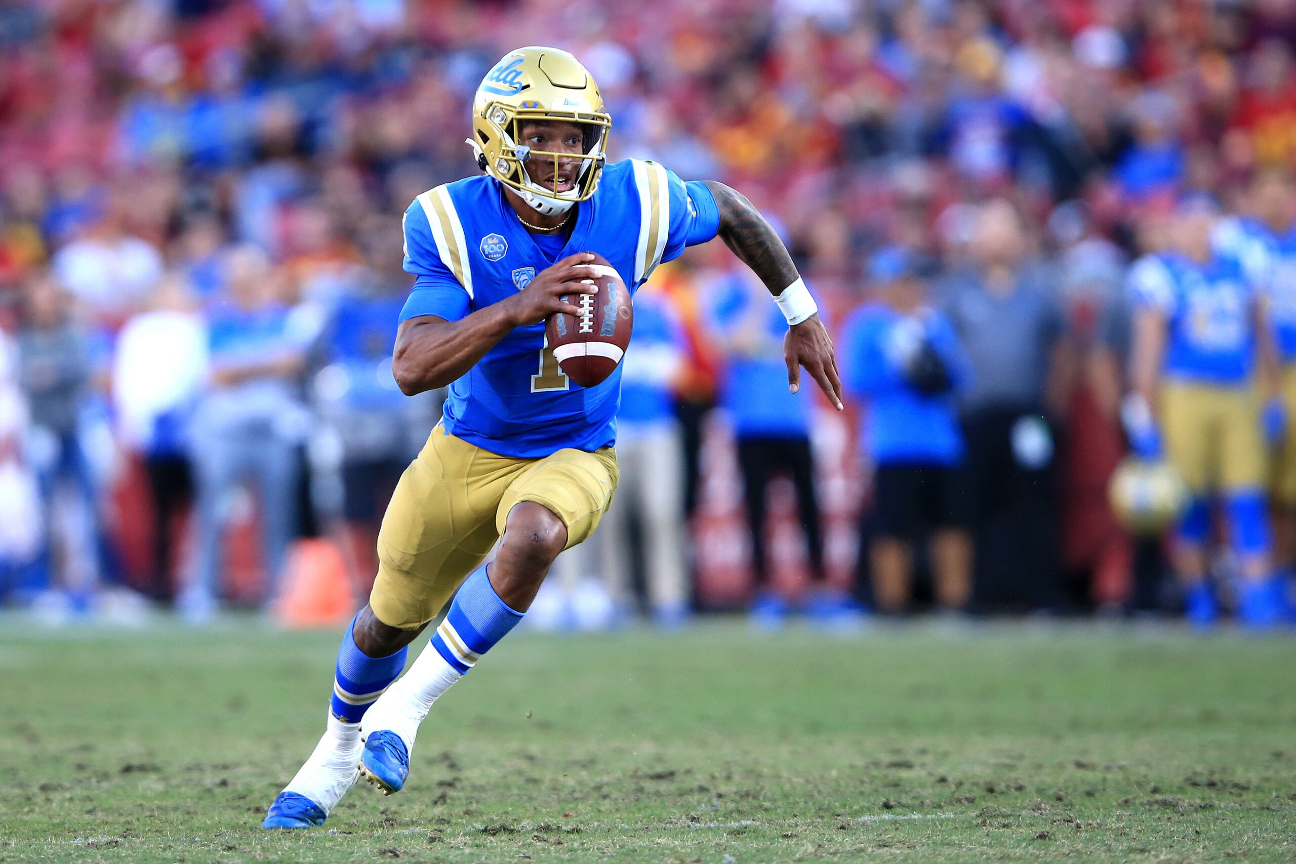 LOS ANGELES, CALIFORNIA - NOVEMBER 23:  Dorian Thompson-Robinson #1 of the UCLA Bruins breaks from the pocket for extra yards during the second half of a game at Los Angeles Memorial Coliseum on November 23, 2019 in Los Angeles, California. (Photo by Sean