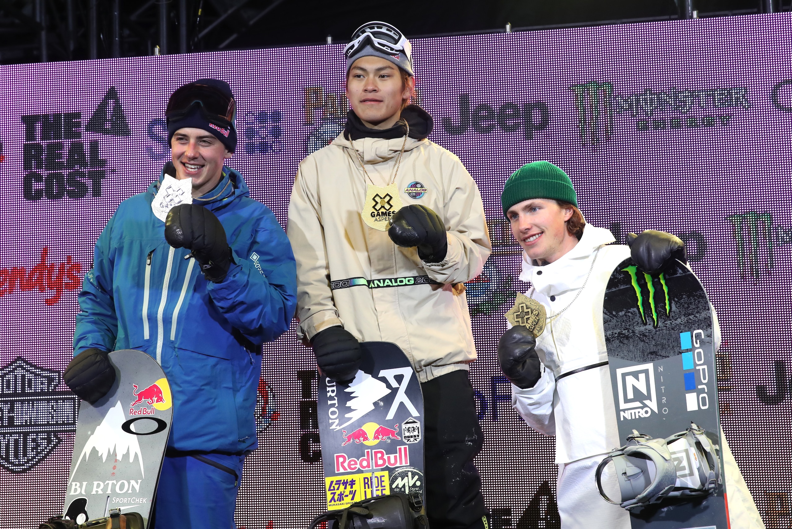 ASPEN, COLORADO - JANUARY 25:   (L-R)  Mark McMorris of Canada second place, Takeru Otsuka of Japan first place and Sven Thorgren of Sweden stand on the podium after receiving medals for the Men's Snowboard Big Air final at the 2019 Winter X Games  on Jan