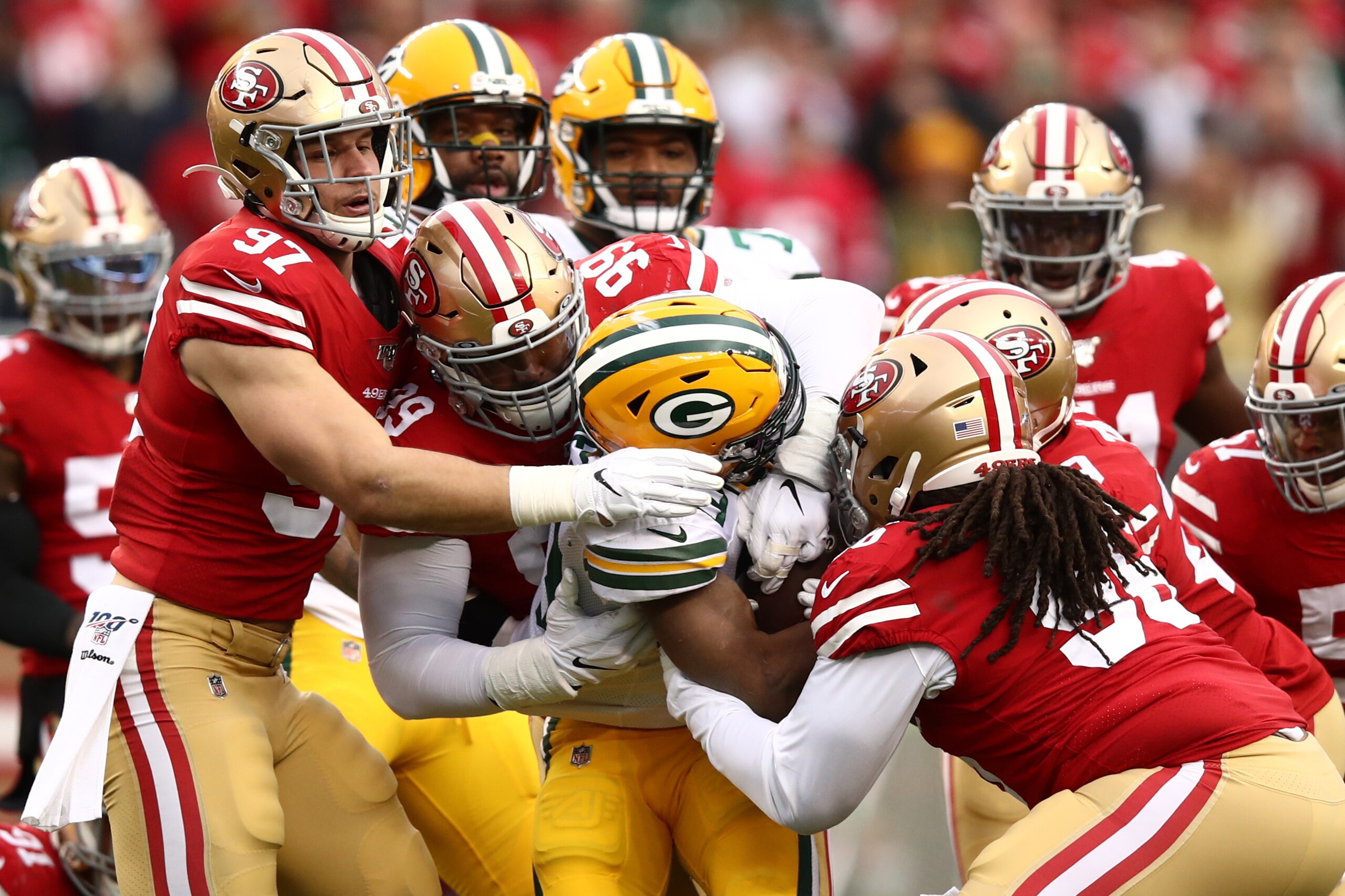 SANTA CLARA, CALIFORNIA - JANUARY 19: Aaron Jones #33 of the Green Bay Packers is tackled by a group of San Francisco 49ers in the first half during the NFC Championship game at Levi's Stadium on January 19, 2020 in Santa Clara, California. (Photo by Ezra SANTA CLARA, CALIFORNIA - JANUARY 19: Aaron Jones #33 of the Green Bay Packers is tackled by a group of San Francisco 49ers in the first half during the NFC Championship game at Levi's Stadium on January 19, 2020 in Santa Clara, California. (Photo by Ezra