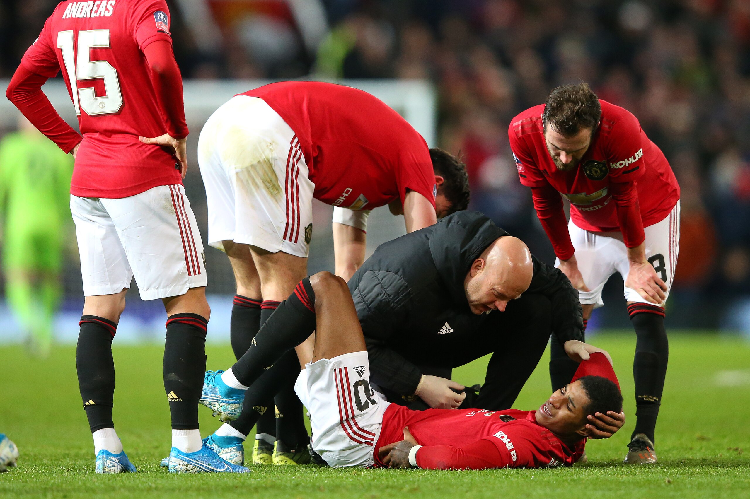MANCHESTER, ENGLAND - JANUARY 15:  Marcus Rashford of Manchester United receives treatment during the FA Cup Third Round Replay match between Manchester United and Wolverhampton Wanderers at Old Trafford on January 15, 2020 in Manchester, England. (Photo 