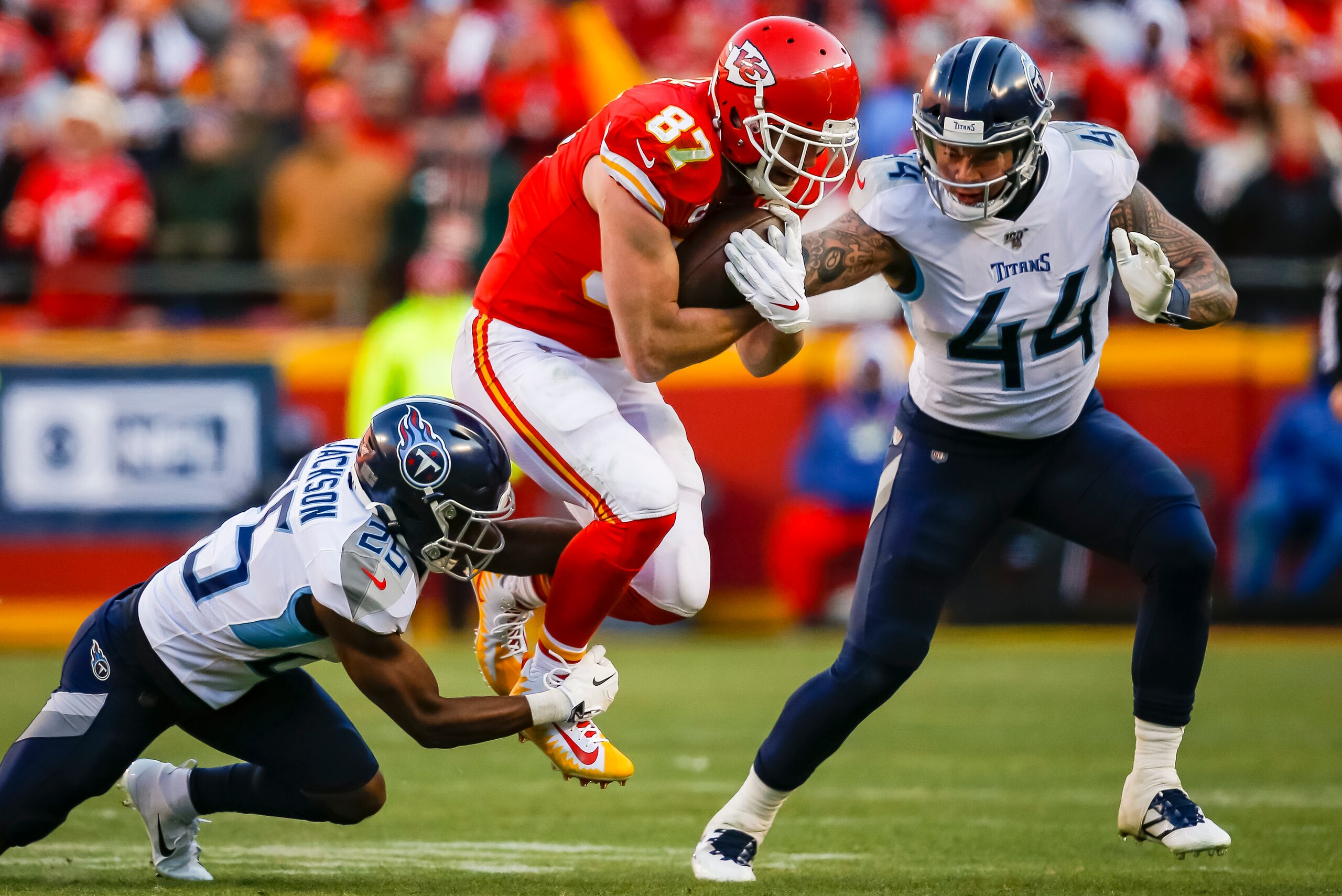 KANSAS CITY, MO - JANUARY 19: Travis Kelce #87 of the Kansas City Chiefs catches a second quarter pass over Adoree' Jackson #25 of the Tennessee Titans and Kamalei Correa #44 of the Tennessee Titans in the AFC Championship game at Arrowhead Stadium on Jan KANSAS CITY, MO - JANUARY 19: Travis Kelce #87 of the Kansas City Chiefs catches a second quarter pass over Adoree' Jackson #25 of the Tennessee Titans and Kamalei Correa #44 of the Tennessee Titans in the AFC Championship game at Arrowhead Stadium on Jan