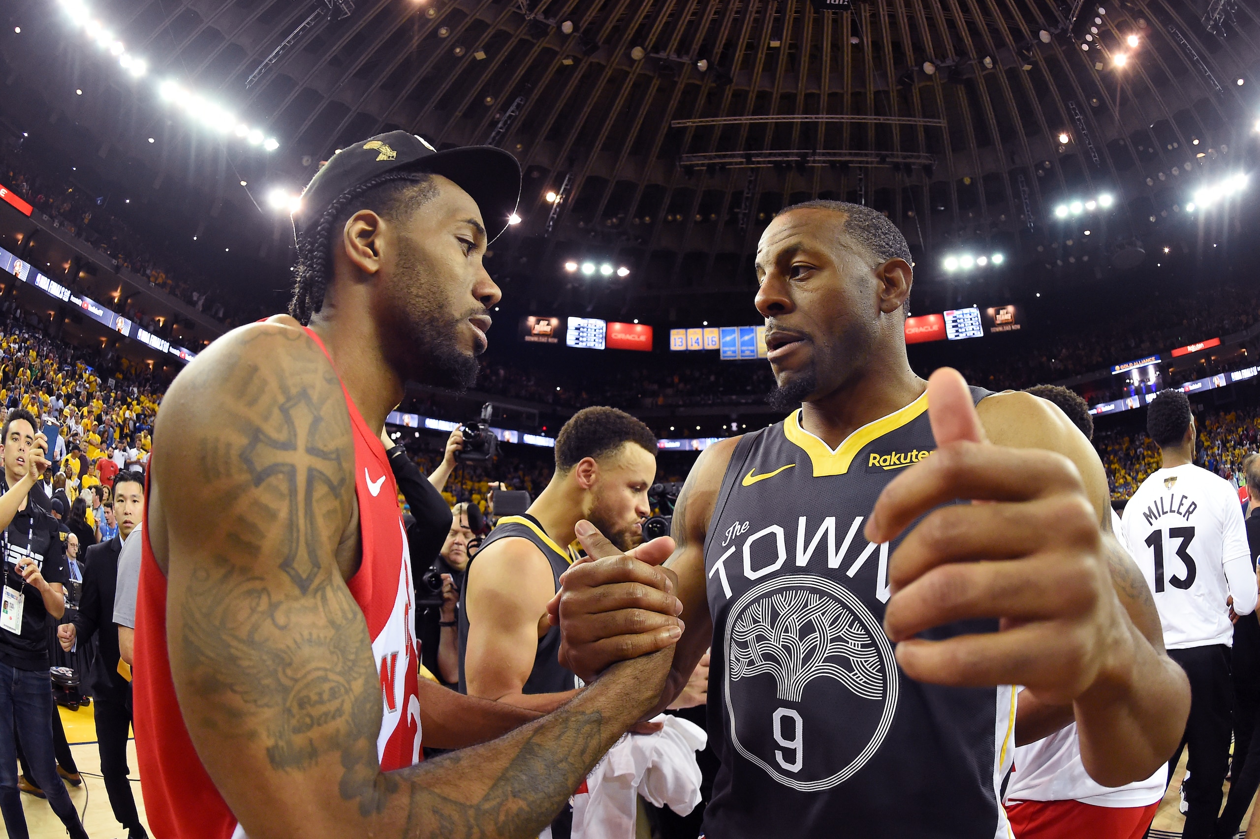 OAKLAND, CA - JUNE 13: Kawhi Leonard #2 of the Toronto Raptors and Andre Iguodala #9 of the Golden State Warriors shake hands after Game Six of the NBA Finals on June 13, 2019 at ORACLE Arena in Oakland, California. NOTE TO USER: User expressly acknowledg