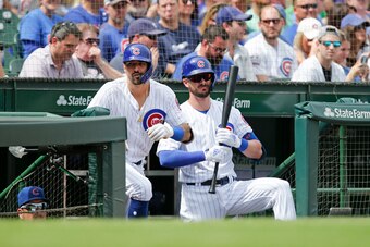 CHICAGO, ILLINOIS - AUGUST 31: Nicholas Castellanos #6 and Kris Bryant #17 of the Chicago Cubs standing on the stairs of the dugout during the first inning of a game against the Milwaukee Brewers at Wrigley Field on August 31, 2019 in Chicago, Illinois. (