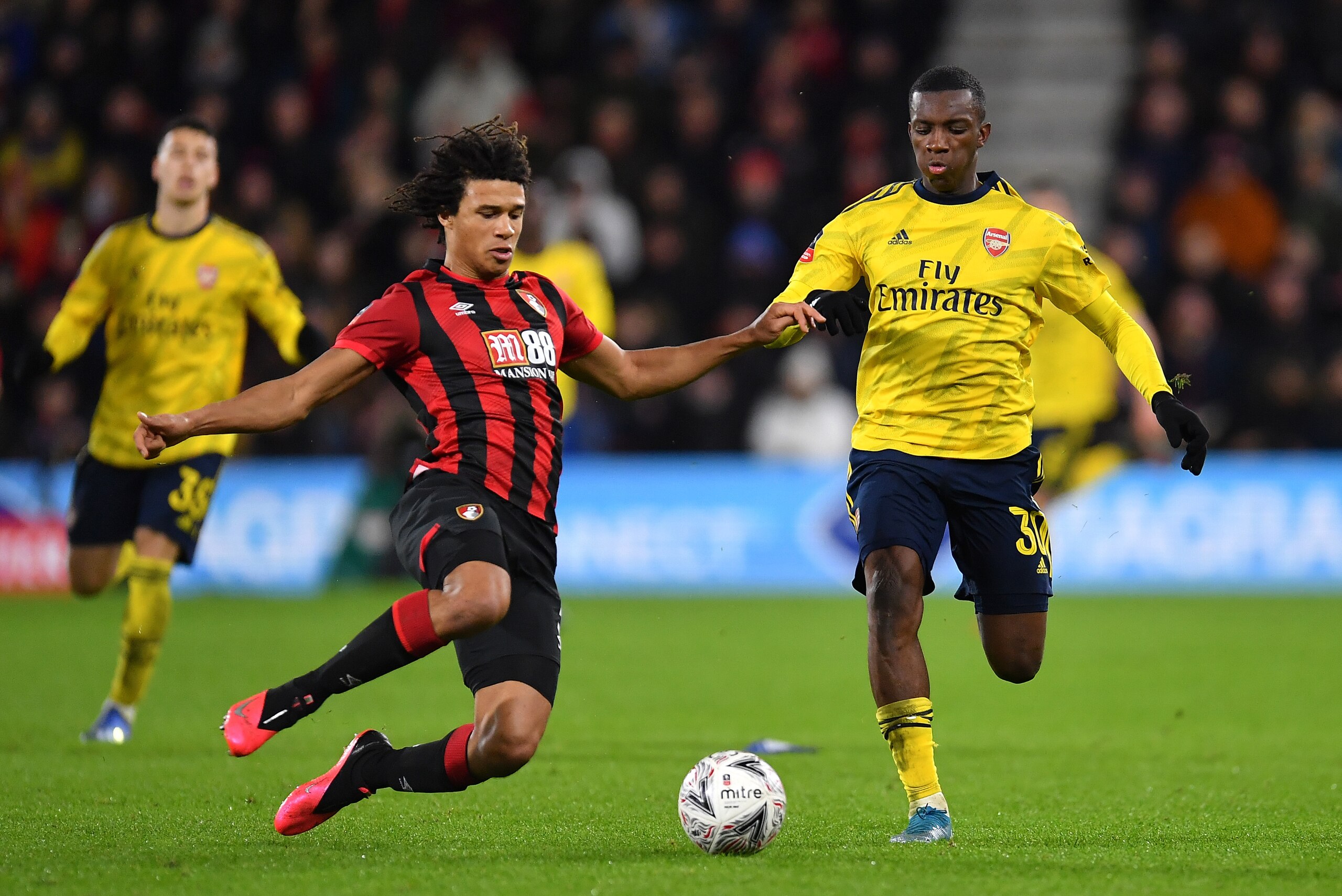 BOURNEMOUTH, ENGLAND - JANUARY 27: Eddie Nketiah of Arsenal is challenged by Nathan Ake of AFC Bournemouth during the FA Cup Fourth Round match between AFC Bournemouth and Arsenal at Vitality Stadium on January 27, 2020 in Bournemouth, England. (Photo by 