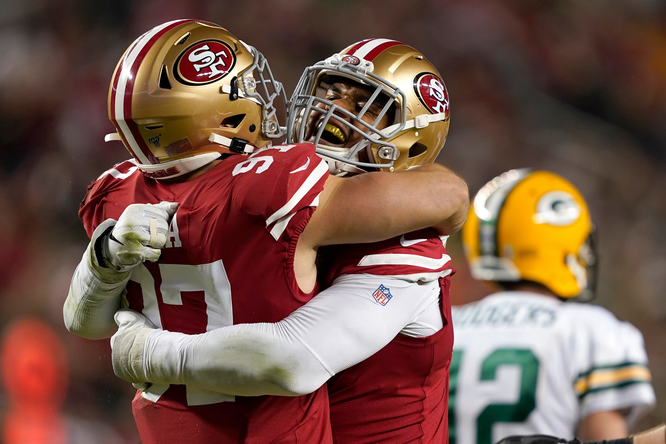 Arik Armstead and Nick Bosa celebrate a big stop in the NFC Championship Game